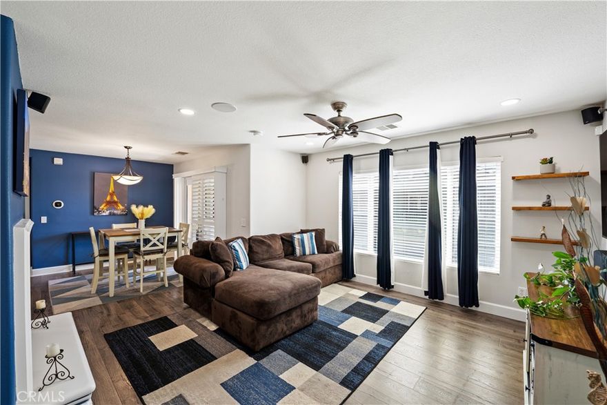Absolutely fabulous 1404 sq ft townhome located in the highly desirable Mariposa community of Plum Canyon. This gorgeous unit is perfect for entertaining with an open floor plan that flows seamlessly from the kitchen through the dining area and into the living room. The kitchen features quartz counters, custom backsplash, beautiful white cabinets and stainless steel appliances. The spacious living room and dining area include a cozy fireplace and access to the balcony, which is a perfect place to enjoy your morning coffee or sip on your favorite cocktail as you enjoy our wonderful Southern California nights. The primary bedroom is large and has a big walk-in closet and en-suite bathroom with dual sinks. The secondary bedroom is also an ample size and is adjacent to the second bathroom, which also includes dual sinks. The townhome also has direct access to the private garage, additional carport space, separate laundry room, upgraded flooring and recessed lighting. A huge plus is the low HOA and no Mello Roos! The Mariposa complex has a community pool with cabanas, spa, clubhouse, BBQ area and playgrounds. Located near top rated schools and the Skyline Ranch Plaza.