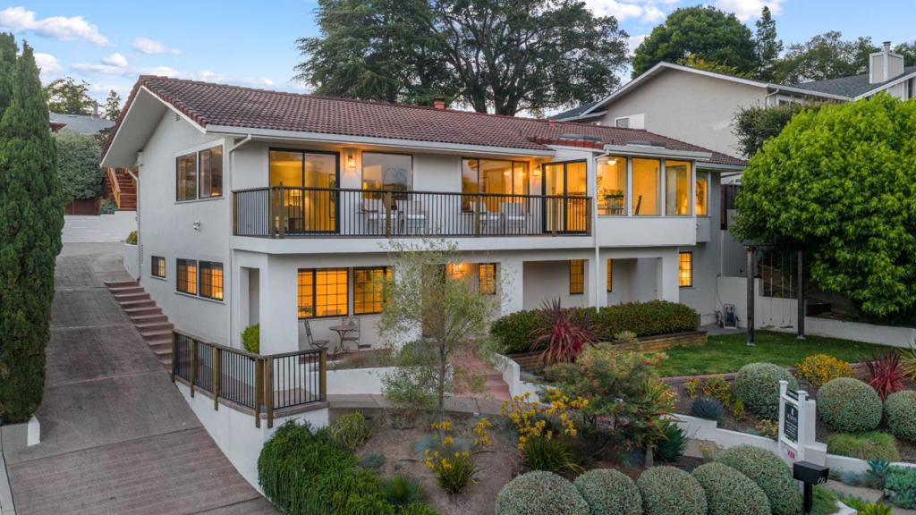 Ocean and forest views from this elegant mediterranean home. This estate blends charm and timeless design in this expansive 4-bedroom, 4-bathroom home located in the desirable Carbonera Estates neighborhood of Santa Cruz. Set on a generous 9,975 sq ft lot, this custom-built property offers approx. 4,000 sq ft of well-planned living space with flexible potential for multi-generational living, remote work, or guest accommodations. Step into a grand foyer with soaring ceilings and natural light, opening to a formal living room. The spacious kitchen is equipped with custom cabinetry, Corian countertops, a center island, built-in appliances, and a cozy breakfast nook that opens to an outdoor deck; perfect for indoor/outdoor entertaining. A formal dining room under skylights and a separate family room with fireplace add warmth and function. The primary suite features a private balcony, walk-in closet, and a spa-inspired bath with jetted tub and dual vanities. Downstairs includes an additional bedroom, full bath, and bonus living area. Enjoy multiple outdoor zones for dining and relaxation, a landscaped yard, and attached 2-car garage. All just minutes from downtown Santa Cruz, beaches, golf, and Hwy 17 access; in a suburban pocket known for privacy and prestige.