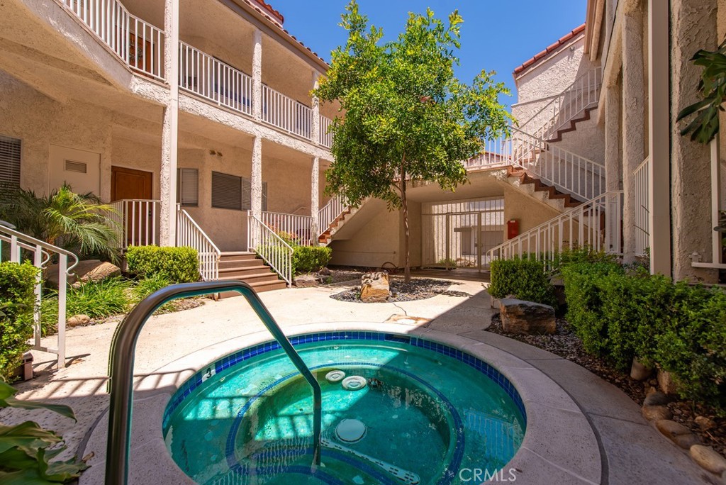 Attention All Simi Valley Buyers & Agents! Wait To Till You See This Beautifully Remodeled & Decorated Unique One-Of-A-Kind Upper Level New York Loft Style Condominium! Located In A Private Gated Building With In Ground Spa In The Courtyard! Wonderfully Located In The Highly Sought After Sycamore Villas Resort Style Community! Perfect Move-in Condition! Dual Pane Windows! New Paint & Carpet! Excellent Floor Plan With Lots & Lots Of Upgrades And Storage! Huge Main Bedroom With Vaulted Ceilings & Walk-In Closet! Marvelously Remodeled Bathroom! Enormous Loft/2nd Bedroom With Walk-In Closet, Vast Workshop & Storage! Lovely Living Room With Unbelievable Soaring Ceilings & Cozy Fireplace! Spacious Balcony With Dual Access! Chef’s Kitchen With Modern Stainless Steel Appliances, Built-In Vacuum Cleaner & Dish Drying Drawer Under The Dishwasher. Terrific Room Sizes! Lock-Up Garage With Storage Closet, Plus Assigned Parking Space! The Fantastic Sycamore Villas Resort Style Development Is Conveniently Located Close To Fine Dining, Shopping, Banks, Medical, Schools, The Movies & Easy Commute. HOA Amenities Include Swimming Pool, Greenbelt With Tennis Courts, Basketball Courts, Park With Children's Playground, RV Community Lock Up Parking Maybe Available For A Fee! If You Are Only Seeing One Sensational Upper Level Condo In Simi Valley In The Price Range, Make Sure This Is It! Must See! Do Not Miss! Simi Valley Living At Its Best!