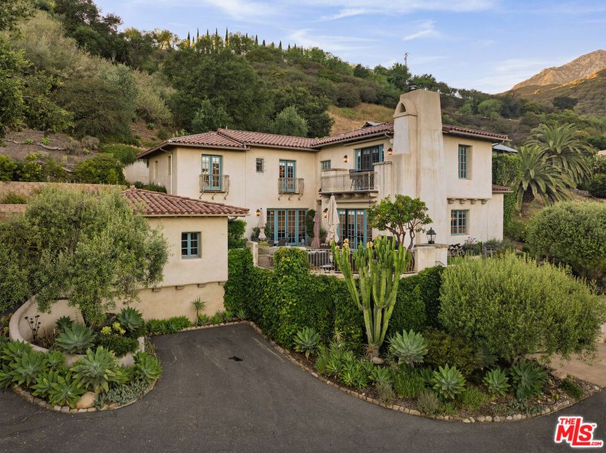 Immersed in nature yet minutes from town, this private Mediterranean-style retreat offers stunning ocean, mountain, & hillside views. Surrounded by native landscaping, it's a haven for nature lovers, artists, & seekers of serenity. Located down a private lane near hiking trails, the Santa Barbara Mission, & the Botanic Gardens, nearly every room enjoys inspiring views. A central courtyard blends indoor-outdoor living, while inside features include wood-beamed ceilings, terracotta floors, two cozy fireplaces, & a spacious newly remodeled kitchen. With 4 bedrooms, including a luxurious primary suite with fireplace & a private view patio, plus a spa, 2-car garage, & terraced gardens, this is Santa Barbara living at its most soulful.