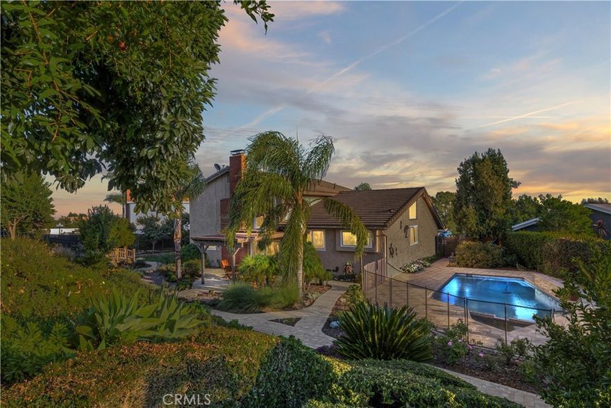 Hi, my name is 5830 Emerald St, But you can just call me Em. I've stood here since 1976 nestled at the end of this quiet cul-de-sac, where the mountains stand like old friends, greeting me each dawn with their timeless beauty. My four bedrooms have cradled so many dreams—especially the one downstairs with its own full bath. That room has hosted many guests who rave about the mountain views. It has seen quiet mornings and late-night secrets, always ready for whoever needs its comfort.

My kitchen, it’s the heart of me, upgraded with care and a clever appliance garage to keep the counters clear for life’s messes. I think back to a winter evening when the family gathered here, rolling dough for cookies, flour dusting their noses, and the warmth of their chatter wrapping around me. Out back, my pool and spa sparkle under the stars, set on nearly half an acre dotted with fruit trees— pomegranates, cherries, grapes, avocados, peaches and more. I remember a summer day when a little boy next door plucked his first avocado, eyes wide with pride. That yard has held picnics, parties, and quiet moments under the shade.

Upstairs, my primary bedroom opens to a balcony where the mountains feel close enough to touch. I’ve watched couples linger there, sipping coffee at sunrise and tea at sunset.  I’m more than walls and windows; I’m a keeper of stories, longing to hold yours next. Come visit, and let’s weave new memories together. Love, EM