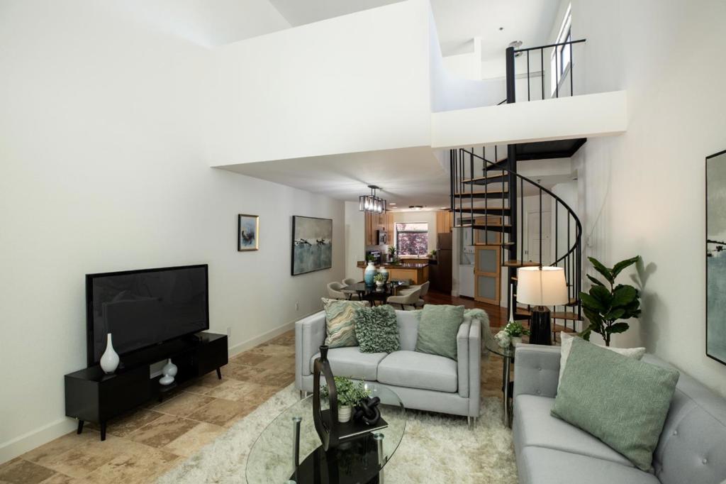 Discover the perfect blend of comfort, convenience, and community in this light-filled condo in beautiful Redwood Shores. The open floorplan allows you entertain with ease and enjoy a home that adapts effortlessly to gatherings, daily life and quiet nights in. The loft-style bedroom gives you versatile space that can grow with your needs- from work/live to a playroom or study area to a private guest suite. Large windows and soaring ceilings bring in natural light, creating an airy, inviting atmosphere. Everyday errands, date nights, and weekend fun are just minutes from your door - no long drives required. The walking and biking trails, lush parks, and waterfront scenery are built-in ways to unwind, stay active, and enjoy the beauty of the Bay ever day. Have the peace of mind knowing you home is in a sought-after school district that supports your family's future.