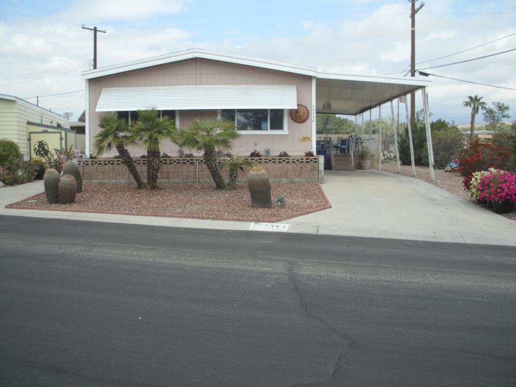 This 1973 140 sq ft. Manufactured home is a 2-bedroom 2 bath. With some upgrades in the Kitchen. Detached golf cart shed, plus storage/workshop. Sold turnkey furnished. Tri palms is an active 55+ community with many activities. Low HOA Fees allowing all the golf 2 owners on title can play, Club House, restaurant, bar, 2 pools, and hot tubs, tennis/pickleball courts, shuffle ball courts. Cose to Costco, Sam's Club, Walmart, Lowes, Home Depot, theaters, and may fine restaurants,