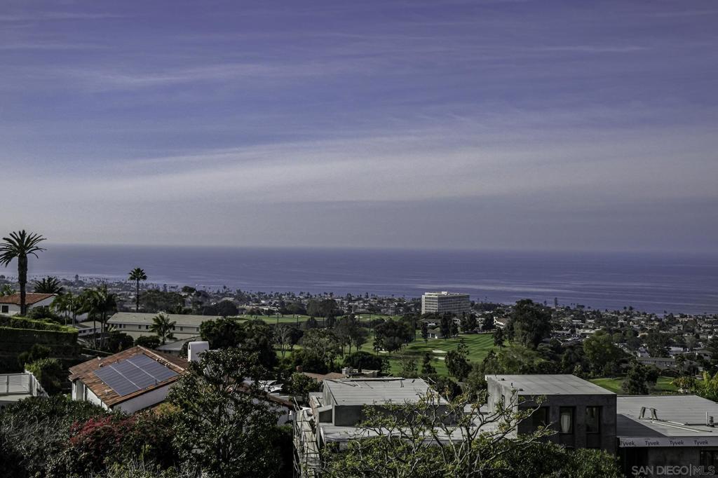 Awe-inspiring Pacific Ocean views from this home that marries traditional charm w/ modern elegance. Rebuilt in 2016 & recently remodeled, lives like a single level, & features wide-plank white oak floors, gourmet kitchen w/ refinished cabinetry, an expansive Calacatta quartz, island w/ bar seating, spa-like primary bath & expansive walk-in closet. 1000+ sq ft. of decks, 16-ft pocket doors, sweeping ocean and golf course views and beyond, make this the ultimate hillside retreat. Lower level has external access guest suite w/ wine storage. Outside has photovoltaic solar, in-deck jacuzzi, rooftop deck w/ fire-pit, and a beautiful landscaping. This home is a masterpiece of modern coastal living. Don't miss your chance to own a piece of La Jolla paradise! Nestled in one of the most sought-after neighborhoods, Country Club, this exquisite home offers the ultimate combination of luxury, style, and breathtaking scenery. Lives like a single level home w/ an ensuite bedroom, great room wine cellar downstairs with outside access, that could be a locked off, junior ADU, Newly refinished and installed view decks, oversized picture windows, and impressive pocket slider doors that seamlessly frame unobstructed views. Unparalleled indoor-outdoor living experience, perfect for hosting or simply soaking in the serene coastal beauty. Gourmet kitchen is a masterpiece, adorned with custom subway tiles, waterfall Calacatta quartz counters, and premium stainless steel appliances. It is as functional as it is beautiful, providing space for culinary creations while doubling as the perfect gathering spot. Throughout the home, you'll find stunning new engineered wide plank oak flooring, new carpet and recessed lighting, blending classic elegance with modern convenience. Generously sized bedrooms ensure comfort & privacy, ideal for families .Meticulously designed floor plan that balances practicality with sophisticated style. Every detail has been thoughtfully crafted to enhance the living experience, from the architectural features to the scenic surroundings. With its countless upgrades and exceptional location, this home is the ultimate blend of luxury and natural beauty.