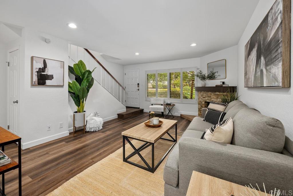 Prime central location: Bay Ho, Clairemont, Pacific Beach, and the convenience of being near Balboa. This light-filled townhome is tucked away and more private - featuring an open floor plan and backyard space, perfect for entertaining or unwinding. Stylish wide-plank LVP flooring flows throughout the home, complemented by crisp white walls and a modern staircase. A stacked stone gas fireplace and plantation shutters anchor the living room, making it both inviting and comfortable. Ideal downstairs half bath features elegant wainscoting and granite countertops. Kitchen features oversized 12”x24” brick-lay tile flooring and a classic subway tile backsplash, glass-front cabinetry, stainless steel appliances, an apron-front sink, pull-out trash, and dining area. Step outside to a fully fenced backyard with a charming brick patio, designated BBQ area, and plenty of room for dining al fresco. A convenient pass-through window from the kitchen seamlessly connects indoor and outdoor living along with the access slider. Upstairs, two generously sized bedrooms with spacious closets, each feature sliding glass doors to a private balcony with sun shades. The upstairs bathroom is appointed with a custom tile tub/shower, granite countertops, wainscoting, and a framed mirror. Additional features include hallway linen closet, deep under stair storage, in-unit stackable washer/dryer, a covered parking space with storage, as well as a second assigned space. Take advantage of community amenities such as a refreshing pool, relaxing hot tub, and racquetball court all included in the HOA along with water and trash. This VA Approved complex is all just moments from the 5 freeway, Pacific Beach, downtown San Diego, premier shopping & dining, plus walking distance to the trolley station! Buyer and buyer’s agent to verify all in MLS prior to COE.