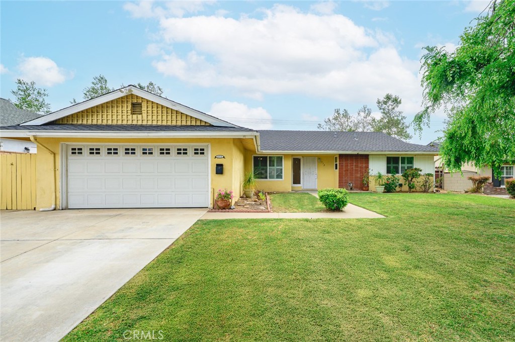 Charming single-story home in a quiet neighborhood with a high ranking school district. Spacious living room with fireplace and sliding door to backyard. All interior walls and bathrooms have been upgraded. The kitchen has ample cabinet space, granite countertops, and a formal dining area. Tile floors in bathrooms and kitchen. Laminate flooring in bedrooms and living room. Two-car garage with direct access to backyard. Conveniently located with established commercial facilities and easy access to the 57 and 210 freeway.