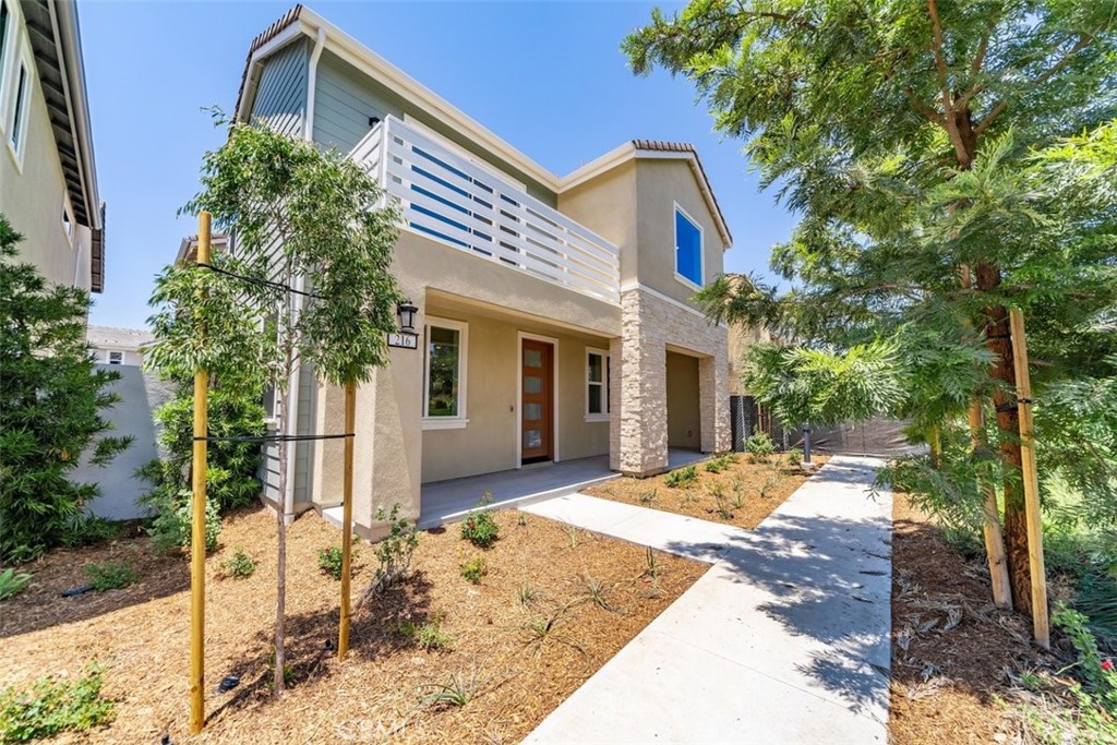 Luxury 4-bedroom, 3.5-bathroom, 3,010 sq. ft. PARK-FRONT home in Irvine’s Great Park. Parents can monitor children playing in the park from the living room, or kitchen. STEPS from top-rated Solis Park Elementary (K-8) and Portola High School (9-12) in Irvine Unified School District. Bright and airy, this modern home boasts abundant windows with scenic park views, perfect for entertaining and relaxing. Sliding doors open to a private landscaped garden, ideal for hosting. The main level features a DOWNSTAIRS BEDROOM with ensuite bathroom, powder room, open floor plan great room, dining room and gourmet kitchen with quartz countertops, GE Monogram appliances, shaker-style cabinetry, and attached 2-car garage pre-wired for EV charging. The second floor offers a bonus room and primary suite with walk-in closet, deck, and spa-like bathroom. Includes 9-foot ceilings and $100,000 in upgrades: custom wainscoting, premium flooring, designer shades. Smart home features: dual-zone thermostats, smart locks, smart doorbell and garage door. Solar cells and water softener reduce utility costs. Enjoy Great Park amenities: pools, playgrounds, trails. Fully furnished option available (+$1,500/month). Book your tour today!