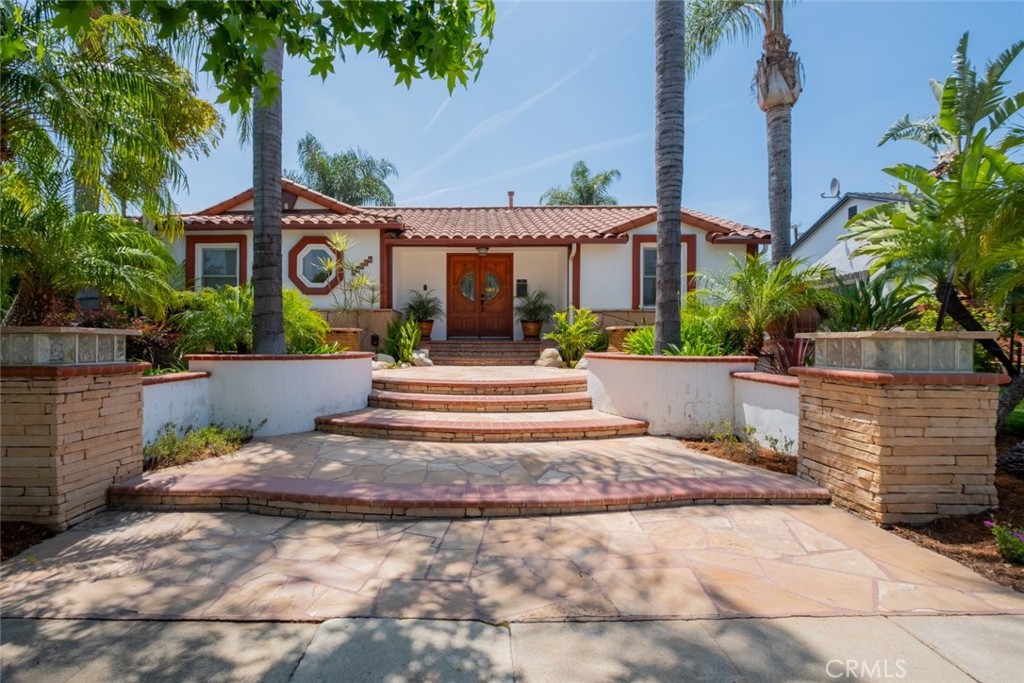 Stunning pool home located in the heart of Northridge with paid solar panels. This beautifully updated 3 bedroom 3 bathroom residence welcomes you with an elegant front pathway and grand double door entry, setting the tone for the comfort and sophistication found throughout. Inside, the spacious layout features a seamless flow between the living room, family room, and kitchen, all enhanced by recessed lighting and an abundance of natural light. The kitchen is fully updated with modern appliances and offers ample space for cooking and dining. Each bedroom is generously sized with plenty of closet space and ceiling fans for added comfort. The individual laundry room adds to the home's practical appeal. The backyard is a true highlight, featuring a sparkling pool, relaxing hot tub, covered patio deck, and a custom tiki bar, perfect for hosting guests or enjoying quiet evenings at home. This home offers a perfect blend of style, function, and outdoor enjoyment in a desirable Northridge location.
