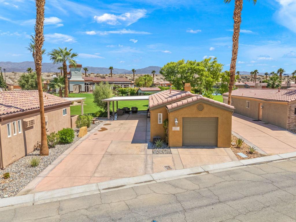Come take a look at this highly upgraded gem in the Vineyards.  With an expansive awning and Majetic views, this unit has it all.  The Vineyards is a gated, luxury motorcoach community offering 69 privately owned lots, each with full Class A RV hookups and custom casitas. Residents enjoy resort-style amenities including pools and spas, clubhouse, fitness center, tennis and pickleball courts, and a regulation with sweeping mountain and desert views. Casitas feature open floor plans, premium kitchens, elegant bathrooms, fireplaces, laundry, and garages--designed for year-round comfort or seasonal retreat. Conveniently located near I-10, shopping, dining, and world-famous Coachella Valley events, The Vineyards offers a vibrant, private setting with strong community appeal. HOA dues include access to all amenities, making this an ideal home base, vacation getaway, or investment opportunity.