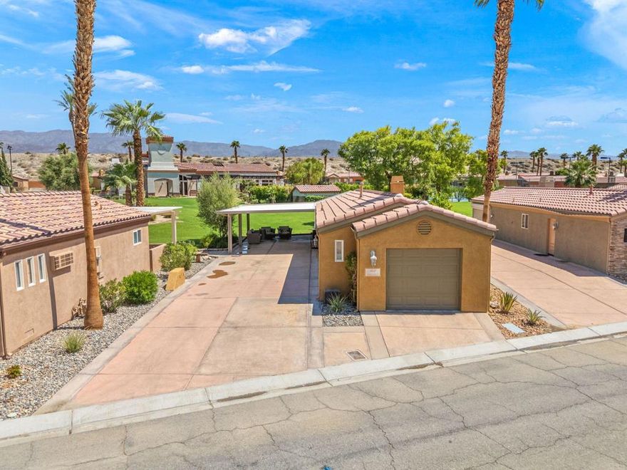 Come take a look at this highly upgraded gem in the Vineyards.  With an expansive awning and Majetic views, this unit has it all.  The Vineyards is a gated, luxury motorcoach community offering 69 privately owned lots, each with full Class A RV hookups and custom casitas. Residents enjoy resort-style amenities including pools and spas, clubhouse, fitness center, tennis and pickleball courts, and a regulation with sweeping mountain and desert views. Casitas feature open floor plans, premium kitchens, elegant bathrooms, fireplaces, laundry, and garages--designed for year-round comfort or seasonal retreat. Conveniently located near I-10, shopping, dining, and world-famous Coachella Valley events, The Vineyards offers a vibrant, private setting with strong community appeal. HOA dues include access to all amenities, making this an ideal home base, vacation getaway, or investment opportunity.