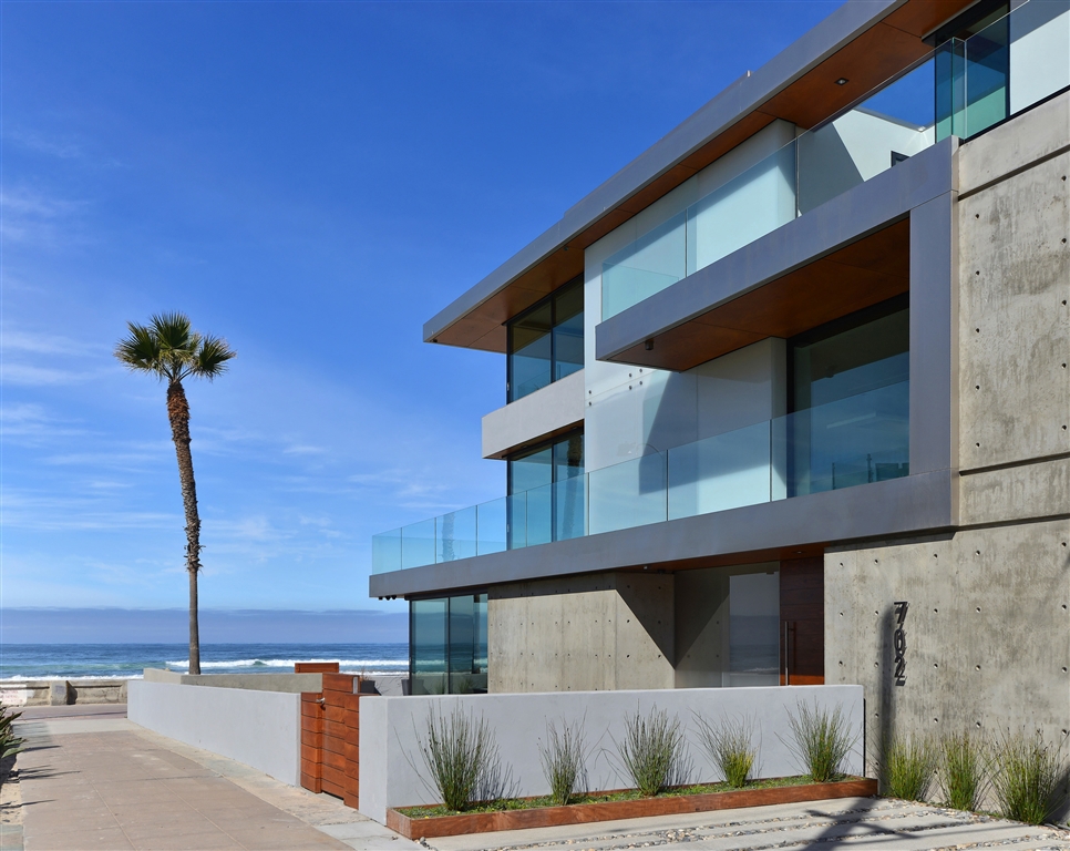 2-years new, Beachfront Modern Masterpiece showcasing awe-inspiring architectural elements, extensive outdoor spaces, & an open concept floor plan perfectly designed to maximize extraordinary ocean, sunset & coastline views found throughout. Two levels of living areas, each with its own kitchen, allow for seamless entertaining on the main floor while maintaining the mid-level great room for your own personal enjoyment (continued in supplement). Sophisticated interior spaces include 4 en suite bedrooms, 5 full baths plus a powder room, an office, elevator service to all 3 floors, and an extensive use of wood, porcelain, glass and stone. The beach level living areas feature floor-to-ceiling Fleetwood doors providing a flawless transition onto an expansive ocean front patio complete with numerous lounging areas, a built-in barbeque and fire pit. Head upstairs where you will find a guest suite, office, as well as the mid-level great room comprised of a sleek cook’s kitchen with Miele appliances plus a Wolf induction cooktop, a family room with a basalt & grey quartz slab fireplace, and a wraparound deck with a full glass railing. The master suite, situated on the top level with 2 additional bedroom suites, boasts vast sea views, a breathtaking bath, and a generous walk-in closet. At the touch of a button, the Crestron smart home panels allow you to intuitively control climate, lighting, electric shades, surround sound and security cameras. Parking is a breeze with a 3-car attached garage plus 2 private parking spaces. Designed in collaboration between Frontis Architecture and EOS Architecture. Expertly built by 4x4 Construction utilizing quality craftsmanship and a meticulous attention to detail. The home’s North Mission Beach location provides an ideal setting to revel in endless ocean views with almost 2 miles of sandy beach beckoning you to indulge in nightly sunset strolls. This is truly unforgettable experience in Coastal living that you do not want to miss! Eq...