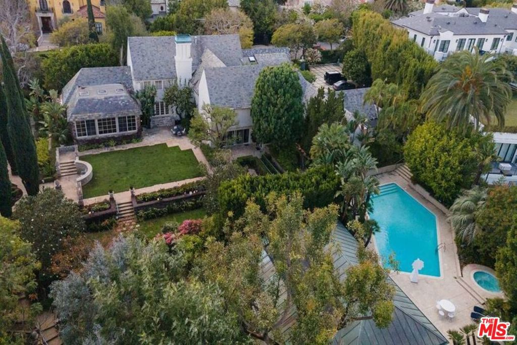 TRUST SALE. Holmby Hills is one of the most prominent locations in the world. Carolwood Drive with spectacular estates has very few opportunities left available to buy, live and enjoy an investment for a lifetime ... at this price. Two Story Gordon Kaufmann Architect French Normandy built in 1925 of approximately 8,000 square feet with Great Room for entertainment. Fenced and gated property, motor court parking, pool and two-room Art studio guest house with wet bar and bath ... Gorgeous grounds of approx. 53,000 square feet of manicured gardens and Koi pond. Views of treetops and greenery with possible Room for Tennis Court. The property is being sold in its present "as is" condition. Rare Opportunity. A signed Coronavirus Property Entry Advisory and Declaration (CAR Form PEAD) is required from anyone who will be entering the property. Submit signed PEAD to LA1.