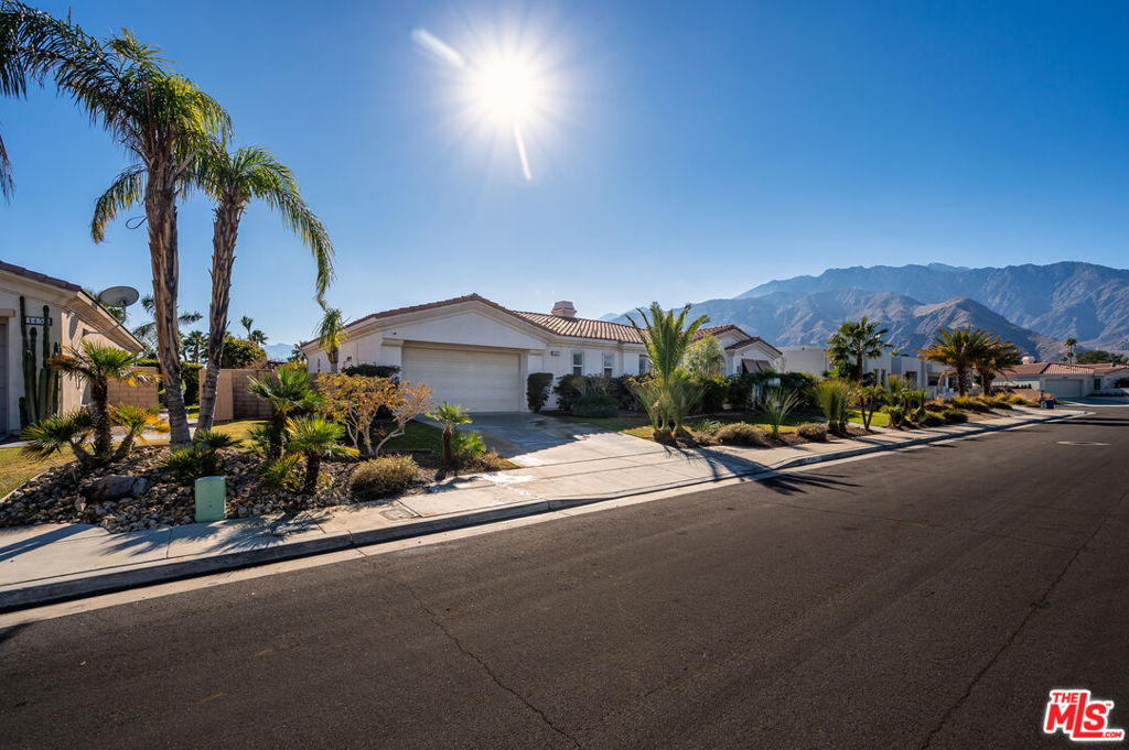 OPPORTUNITY AWAITS! This home is currently being used a successful STR. This stunningly updated 4-bedroom (includes detached casita), 3.5-bath home offers the ideal blend of luxury, comfort, and Palm Springs charm. Located just minutes from the vibrant downtown district, this expansive property is perfect as a full-time residence, second home, or investment opportunity. Step inside to an open-concept living space featuring high ceilings, a beautifully appointed kitchen with modern finishes, and multiple areas for entertaining. The heart of the home includes a chef's kitchen with extensive cabinetry, high-end small appliances, and a large center island perfect for gatherings. The spacious living and dining areas flow seamlessly into the backyard, creating an indoor-outdoor experience that defines Palm Springs lifestyle . The home offers four generously sized bedrooms all currently furnished with king beds and smart TVs plus a converted office/bonus room that functions as a fifth bedroom. The primary suite features direct backyard access, a luxurious en-suite bath with soaking tub and separate shower, and a designated workspace. One of the bedrooms is a detached casita with its own entrance, full en-suite bath, and office nook. Outside, enjoy your own private resort-style retreat with a sparkling pool and spa, breathtaking mountain views, a fire pit conversation area, sun loungers, and a covered patio with al fresco dining. Additional features include: Bonus room with double door entry. Three full bathrooms plus powder room. Dedicated laundry room and attached garage. Ample storage and closet space throughout. Fully furnished and Turnkey-ready for short-term rental or move-in. Don't miss the opportunity to own this beautifully maintained and highly functional desert escape in one of Palm Springs' most sought-after locations. Sold as is - buyer to verify all permits and records.