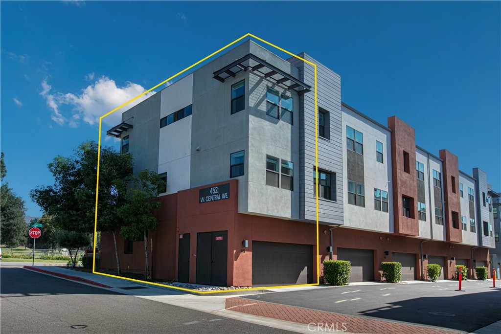 Located in the highly desirable West Village by Trumark Homes, 448 W Central Ave is a beautifully upgraded 3-bedroom, 3.5-bathroom plus one bonus room in the first-floor townhome spanning 2,247 sq. ft. in the heart of Brea. This end-unit home offers a spacious, modern design with high-end finishes and thoughtful details. The first-floor bonus room with an en-suite bath is perfect for a home office, Gym or future 4th bedroom. A floating wood staircase leads to the second floor, where an open-concept layout seamlessly connects the kitchen, dining, and family room. The chef’s kitchen features a large quartz island, white shaker cabinetry, stainless steel appliances, and a farmhouse sink. The living room includes a modern recessed glass fireplace, while a sliding glass door opens to a private balcony. The third floor features a luxurious primary suite with a walk-in closet and dual-sink vanity. another two bedroom both have full bathroom provide ample space for family and guests. This home is fully upgraded with premium flooring, recessed lighting, Energy-conscious upgrades include fully owned solar panels, split AC units throughout the home, extra insulation in exterior walls and windows to reduce street noise, and a tankless water heater. The kitchen and primary suite each open to private balconies with serene hill views, adding a touch of tranquility to your daily routine. An architectural staircase adds style and character to the interior as soon as you enter the front door. The attached two-car garage provides ample storage. Located in a top-rated school district, this home is minutes from shopping, dining, entertainment, and freeway access. The HOA community offers a private park, playground, and splash pad, making it ideal for families. Don’t miss this opportunity to own a modern, stylish home in one of Brea’s most sought-after communities! Schedule your tour today!