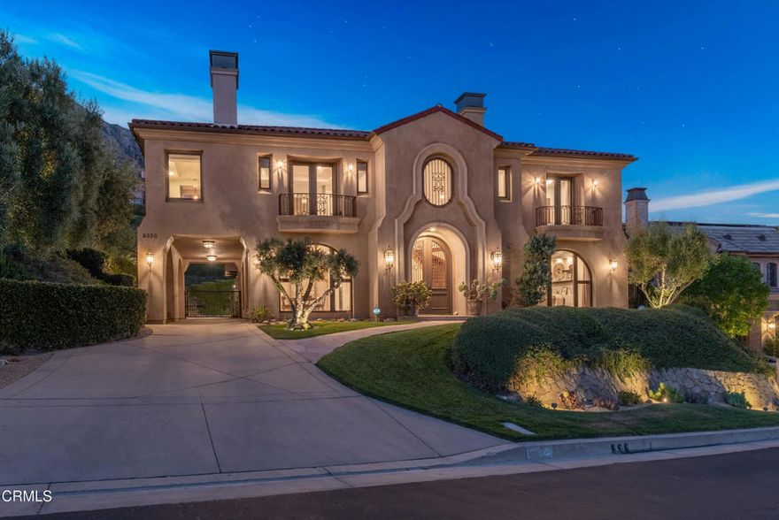 Welcome to 2330 Crystal Lane, a breathtaking Spanish Mediterranean estate in Pasadena's exclusive gated Kinneloa Ridge Estates. Built in 2006 by Mur-Sol Construction and designed by Robert Tong, this grand 5BD/4.5BA home spans approximately 5,237 sq ft on a 32,963 sq ft lot with panoramic views of the San Gabriel Valley, downtown LA, mountains, and glimpses of the ocean on clear days.Enter a dramatic foyer with a sweeping staircase, 20-foot ceilings, and elegant arched doorways leading to expansive living and dining spaces. Front rooms capture spectacular vistas, while beamed ceilings add architectural warmth. The gourmet kitchen boasts an eat-in area with Travertine floors, Sub-Zero and Viking appliances, Wolf double ovens, two Bosch dishwashers, and a large island with prep sink. Light-toned walls and granite counters contrast rich dark cabinetry. A butler's pantry with wet bar and JennAir beverage fridge connects the kitchen and dining room for seamless entertaining.French doors and sliders lead to a private courtyard oasis featuring a custom fountain spilling into a 10-person spa, cozy outdoor gas fireplace, lounge and dining areas, fruit trees, succulents, and bamboo. The grounds are freshly landscaped with mature olive, plum, apricot, fig, pomegranate, lemon trees, and raised vegetable beds for farm-to-table living.The versatile layout offers a downstairs bedroom/office suite ideal for guests or multi-gen living. Upstairs includes three secondary bedrooms--one en suite with a balcony and two with a Jack-and-Jill bath. The luxurious primary suite is a private retreat with a resort-like bath featuring limestone counters, Walker Zanger tiles, dual vanities, a two-sided fireplace, jetted tub, and a spacious custom closet. Enjoy sunrises and city lights from the private balcony.Additional highlights include hardwood floors, updated LED lighting, Pella windows, retractable screens, surround sound, solar panels, zoned HVAC, new water tank, UniFi whole-house Wi-Fi, full laundry room, finished 3-car garage, and meticulously maintained by the original owner.Located on a quiet cul-de-sac near Eaton Canyon trails, golf, top schools, Old Town Pasadena, Huntington Library, Rose Bowl, 210 freeway, and the Metro A Line. Experience timeless elegance, luxury, and stunning views--welcome home to Crystal Lane!