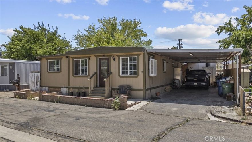 Now available in Palmdale, this spacious 5-bedroom, 2-bathroom home offers 1,416 square feet of versatile living space and is a standout opportunity in the area. This well-maintained mobile home features a warm and inviting interior with wood-style flooring throughout and a spacious open-concept layout that blends the living, dining, and kitchen areas seamlessly. The kitchen is equipped with ample cabinetry, granite-style countertops, and a central island, ideal for cooking and entertaining. Each bedroom offers its own charm and flexibility, providing room for family, guests, or even a home office. The updated bathrooms include modern vanities and finishes, adding both comfort and functionality. A large, covered patio in the backyard provides a shaded area perfect for gatherings, relaxation, or outdoor hobbies. There's also a dedicated storage area and workspace, offering additional value and usability.