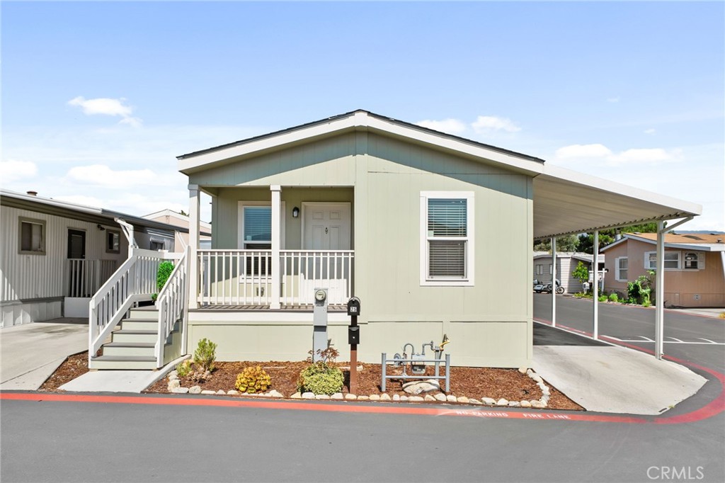 Welcome to this charming manufactured home located in the Sycamore Villas Community, offering comfort, convenience, and community amenities! Being built in 2023, this home features a clean exterior with a covered carport and a welcoming front porch, this home has great curb appeal. Inside, you’ll find a cozy carpeted living room that flows into an open kitchen and dining area, perfect for gatherings. The kitchen is highlighted with granite counters and plenty of cabinet space. With three spacious bedrooms and two full bathrooms, including a primary suite, there’s room for everyone. A dedicated laundry room adds to the functionality of this home.
Located in a vibrant community, you’ll enjoy access to resort-style amenities including a pool, spa, clubhouse, billiards room, gym, and even a basketball court area. This home blends everyday comfort with recreational living—ready for you to move in and make it your own!