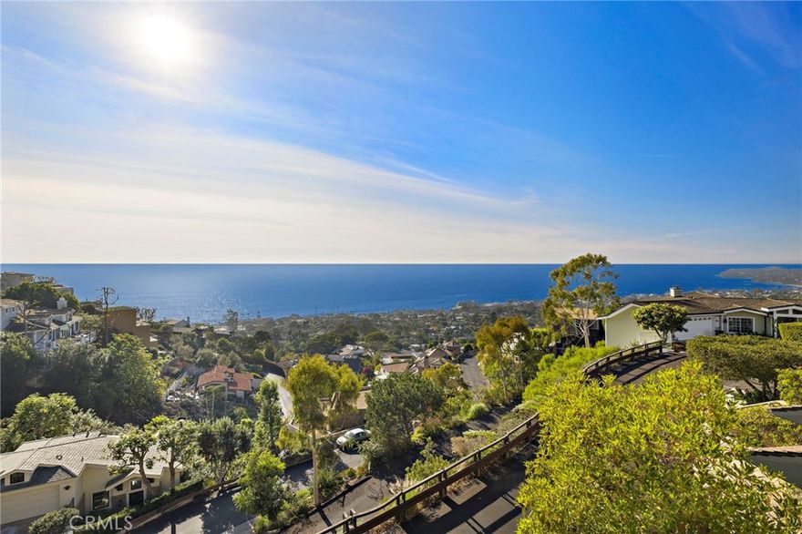 Positioned at the top of a quiet cul-de-sac in Laguna Beach, this home offers sweeping, uninterrupted views of the Pacific, Catalina and the dramatic Laguna coastline. The setting offers both privacy and easy access to Woods Cove and Moss Point Beach,  two of the area’s most beloved stretches of sand. With just under four thousand square feet, the property includes four spacious bedrooms, and 4.5 luxurious baths. The primary suite features a fireplace, dual sinks, a soaking tub and a private terrace facing the water. The upper level also includes a comfortable secondary living area with the home’s second fireplace. The main level centers around a large chef’s kitchen with high end appliances, a generous island and an adjacent pantry and laundry room with elevator access. The dining area and main living room capture the ocean views and open to outdoor space for easy entertaining. Several additional terraces and patios around the property offer more options for outdoor dining and relaxing. Nestled in a tranquil location near world-class dining, shopping, and art galleries, this home embodies the very best of Laguna Beach living.