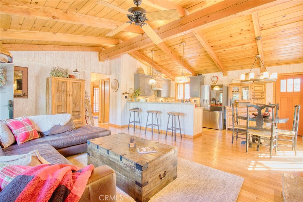 The Acorn’s Nest – A Designer Mountain Retreat!
Welcome to The Acorn’s Nest, an upgraded mountain charmer that seamlessly blends cozy cabin vibes with modern luxury. This fully remodeled designer home boasts high-end finishes throughout and is sure to impress even the most discerning buyers!
Enjoy single-level living with an open-concept layout featuring 2 spacious bedrooms and 1 beautifully updated bathroom. The interior is flooded with natural light thanks to high-quality double-pane crank-out windows and French doors, offering effortless access to the expansive wraparound deck—ideal for outdoor dining, entertaining, or simply soaking in the peaceful mountain setting.
The kitchen is a chef’s dream with granite countertops, a farmhouse sink, and sleek stainless-steel appliances. Rich wood flooring and ceiling fans throughout add comfort and elegance, while thoughtful upgrades like new siding and insulation on one side of the home ensure year-round efficiency.
Step outside to a beautifully landscaped side yard with lush grass, a rock retaining wall, and a sprinkler/drip irrigation system. Additional features include a dedicated laundry room, storage shed with electricity, whole-house water filtration system, and a 5-year-old septic tank. Gutters surround the home for added protection.
Located on a private corner lot on prestigious Acorn Road, this home is perfectly positioned where the street ends at Acorn Trail, a direct path to the Pacific Crest Trail—a dream for hikers and nature lovers.
Don’t miss your chance to own this turnkey mountain escape. The Acorn’s Nest is truly a rare find!