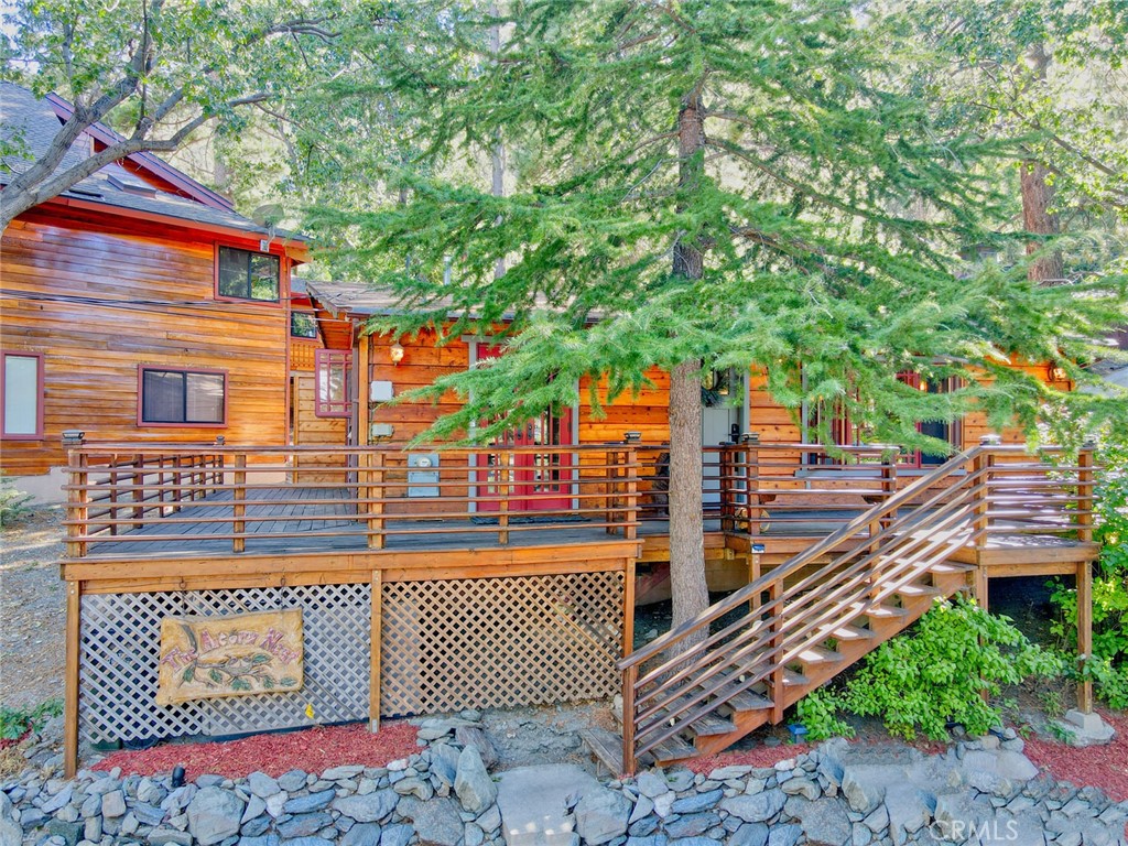 The Acorn’s Nest – A Designer Mountain Retreat!
Welcome to The Acorn’s Nest, an upgraded mountain charmer that seamlessly blends cozy cabin vibes with modern luxury. This fully remodeled designer home boasts high-end finishes throughout and is sure to impress even the most discerning buyers!
Enjoy single-level living with an open-concept layout featuring 2 spacious bedrooms and 1 beautifully updated bathroom. The interior is flooded with natural light thanks to high-quality double-pane crank-out windows and French doors, offering effortless access to the expansive wraparound deck—ideal for outdoor dining, entertaining, or simply soaking in the peaceful mountain setting.
The kitchen is a chef’s dream with granite countertops, a farmhouse sink, and sleek stainless-steel appliances. Rich wood flooring and ceiling fans throughout add comfort and elegance, while thoughtful upgrades like new siding and insulation on one side of the home ensure year-round efficiency.
Step outside to a beautifully landscaped side yard with lush grass, a rock retaining wall, and a sprinkler/drip irrigation system. Additional features include a dedicated laundry room, storage shed with electricity, whole-house water filtration system, and a 5-year-old septic tank. Gutters surround the home for added protection.
Located on a private corner lot on prestigious Acorn Road, this home is perfectly positioned where the street ends at Acorn Trail, a direct path to the Pacific Crest Trail—a dream for hikers and nature lovers.
Don’t miss your chance to own this turnkey mountain escape. The Acorn’s Nest is truly a rare find!