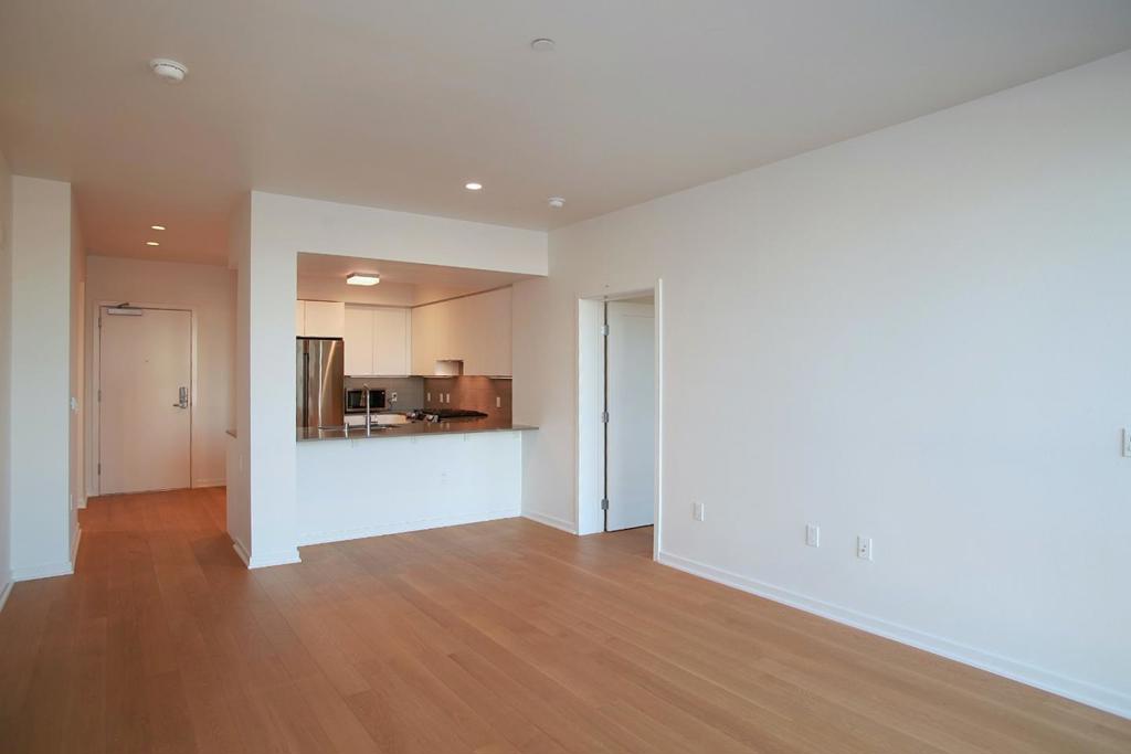 Discover the charm of downtown South San Francisco's newest lease opportunity! This modern condo features 2 spacious bedrooms and 2 bathrooms, along with engineered wood flooring throughout. The open layout boasts floor-to-ceiling windows, flooding the space with natural light and offering stunning views. Enjoy the convenience of a private balcony extending from the living room. The sleek kitchen is a chefs dream, complete with stainless steel appliances, a dishwasher, and ample storage. Additional perks include in-unit laundry, air conditioning, and a dedicated storage space. Residents are welcomed into a stylish lobby with a virtual doorman and package lockers. Relax in the lushly landscaped courtyard featuring an outdoor fireplace, comfortable seating, and barbecue stations. Host gatherings in the community lounge, which includes a full kitchen and entertainment area, or take in breathtaking views from the Sky Lounge and terrace. This home truly blends luxury, convenience, and a vibrant community setting!