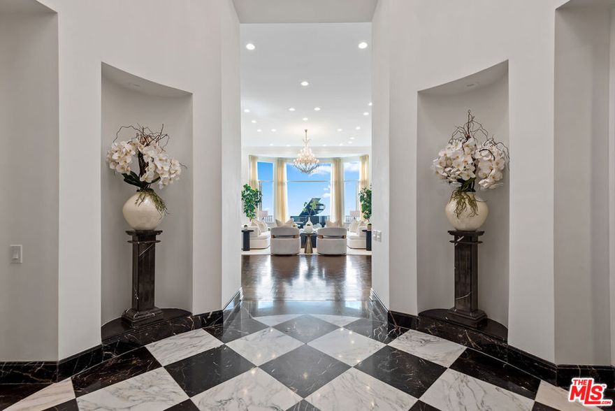 Once in a generation opportunity to live in Trousdale's prestigious Billionaires Row, considered to be one of the finest locations in Beverly Hills. Grand Traditional home set behind gates with inviting floor plan perched on nearly half an acre overlooking jetliner views from Downtown to the ocean. Dramatic soaring ceilings and spectacular views from formal living room, large dining room and family room with wood paneled bookcase and full bar for entertaining.  Gourmet kitchen with center island, butler's pantry, breakfast nook and top-of-the-line appliances. Primary bedroom with floor-to-ceiling windows, sitting area, separate spa like bathrooms, walk-in closets and sauna. Three additional en suite bedrooms in the main wing along with gym, massage room and optional bedroom. Expansive back yard with patio, outdoor dining areas, large pool and detached cabana with bathroom. Private office, full laundry room and separate wing for family and/or staff.  3-car garage with generous motor court. Call for furnished pricing