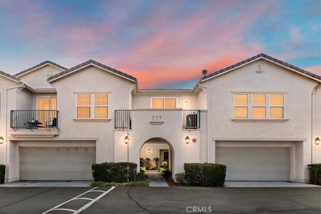 Welcome to this beautifully maintained 3-bedroom, 2.5-bath condo located in the desirable Casabella community in Winchester. With approximately 1,700 square feet of living space, this inviting home offers comfort, style, and convenience in a well-appointed setting. A courtyard entry provides a warm and welcoming first impression, leading into a light-filled interior that has just been updated with brand new carpet and a full interior repaint—making it truly move-in ready. The spacious great room features a cozy stacked stone fireplace that anchors the space and creates a relaxing ambiance. The kitchen is tastefully upgraded with sleek counters, stone backsplash, and plenty of cabinetry, offering both functionality and visual appeal. The stainless steel refrigerator, along with the washer and dryer, are included—adding extra value and convenience for the new owner. Plantation shutters adorn most rooms, enhancing both privacy and elegance, while ceiling fans and upgraded lighting in the bathrooms add thoughtful finishing touches. The spacious primary suite includes a large walk-in closet and a generous en-suite bathroom. Step outside to a cozy back patio area with no neighbors behind—an ideal spot to unwind and enjoy the serene surroundings. The attached two-car garage provides added convenience, and the community itself offers fantastic amenities including a pool and spa, parks, a playground, and beautifully landscaped common areas. All of this in a great location with easy access to city parks, shopping, and restaurants—a wonderful place to call home.