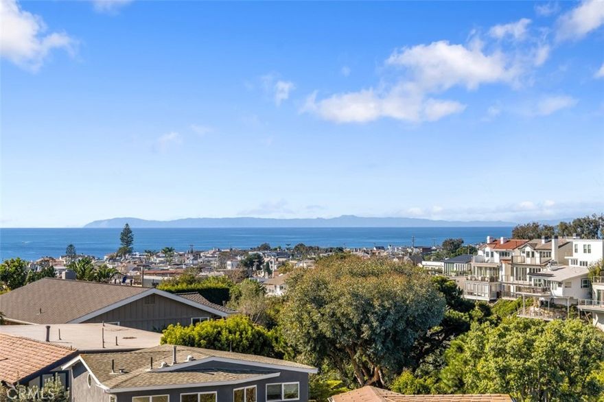 Perched in the exclusive enclave of Corona Highlands, 420 De Sola Terrace is a redefined oceanview estate with elevated finishes and sophistication throughout. Originally reimagined by renowned architect Chris Light, this four-bedroom, four-bathroom home (including a dedicated office and two elegant powder rooms) spans approximately 3,500 square feet on an expansive 7,250-square-foot lot.
The open-concept layout flows seamlessly through sun adorned living spaces and a family-style dining area framed by sweeping ocean vistas. A chef’s kitchen with stone countertops and a double Viking range connects effortlessly to these spaces, perfect for everyday living and entertaining.
The serene main-level primary suite offers breathtaking views, a ceiling-mounted drop-down TV, remote-controlled drapery, and a spa-inspired bath with custom tilework and luxurious finishes. Also on this level is a refined office, designed to meet the demands of top-tier executives.
A true entertainer’s haven, the new lower-level retreat is appointed with a second kitchen featuring travertine countertops, designer curated lighting, custom cabinetry, beverage fridges, an ice machine, a two-keg tap system, and a custom theatre/game room.
This level also features a stylish powder room with custom cabinetry, a concealed-entry laundry room, and an impressive walk-in wine cellar. Two additional bedrooms—one with direct access to the lush poolside retreat—share a Jack-and-Jill bath, offering privacy and comfort for guests.
Resort-style amenities include a saltwater pool with all-new systems, a swim-up bar, built-in BBQs, and mature landscaping curated for privacy. The home is fully equipped with smart home technology, including Savant AV automation, a new surround sound system.
Enjoy panoramic ocean views and nightly sunsets from nearly every room—or from one of several outdoor spaces: a wraparound deck with firepit off the main living area, a rooftop stargazing terrace with fireplace, or the private balcony off the primary suite.
Residents of Corona Highlands enjoy exclusive access to the coveted Shore Cliffs beach and are just a short stroll from the heart of Corona del Mar Village—home to world-class dining, boutique shopping. Minutes from Big Corona, Little Corona, and the beaches that define the CdM lifestyle, this prime location also offers effortless access to Fashion Island, Pelican Hill Resort, and John Wayne Airport—placing the best of coastal Orange County at your doorstep.