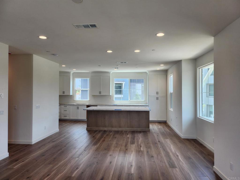 Brand new build just a short drive to the coast! End unit, lots of windows. Views! Views! Views! Among the last of the opportunities to get a townhome at Coral Ridge with a view. This under construction unit, offers beautiful sunsets and hillside views. Perched at the edge of the of the Coral Ridge community. This soon to be stunning location still provides the opportunity for your personalization, from cabinets to counters, to flooring and appliances. Part of the Marja Acres plan, Coral Ridge will be sharing a Community pool, spa, playground, restrooms, firepit, lounge areas, cornhole, bocce ball court, and community dog park. Coral Ridge plan 2 will feature spacious kitchen and large island. Bonus room/ office area on the first level with a half bath. Great room/ kitchen/ dining with half bath on second level. Three bedrooms, 2 full baths and laundry on the third level. Personalize your cabinets/ countertops and flooring at our Design Studio for a limited time. Energy Star certified construction with included, owned solar system, with and ring doorbell included. Builder backed warrantied home from one of the nation’s largest builders. Unique opportunity for new on the coast, in a coveted area with access to some of the best schools in San Diego County! In house financing is available through builder financier. Visit sales office to access models for this brand-new opportunity! Pictures are of model home. Buyer can personalize their home at our design studio.