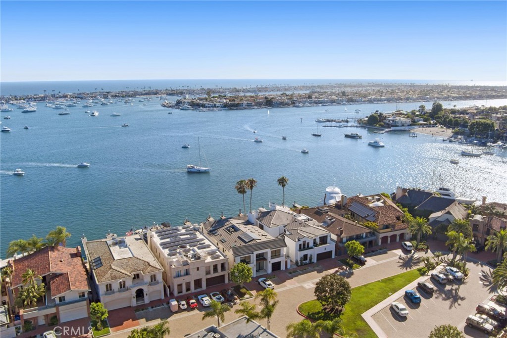 Boasting a coveted main turning basin location with some of the best views in Newport Bay, this spectacular bayfront residence located on Linda Isle’s premier Gold Coast features 3 bedrooms and an office (which could be converted back into a 4th bedroom), 5.5 bathrooms and approximately 5,835 square feet of luxury living space. Nestled within an exclusive 24-hour guard gated community, 39 Linda Isle offers a rare opportunity for a truly extraordinary waterfront living experience. Take in unparalleled wall-to-wall views from the spacious primary living suite with separate his and her bathrooms and walk-in closets. Designed for seamless entertaining, formal dining and living areas flow effortlessly to a Chef’s kitchen and open to a breathtaking 50’ of bayfront footage. The private dock can accommodate a yacht approximately 60 feet in length and has multiple side ties on both sides of the dock. Countless amenities include an elevator, new carpet, marble flooring, multiple fireplaces, an impressive 904-bottle wine cellar and tasting room with bar, and AC. Community amenities offer residents access to a private beach, tennis court, clubhouse, and an abundance of guest parking. Enjoy convenient access to countless beach activities, world-class shopping, fine dining and outstanding schools.