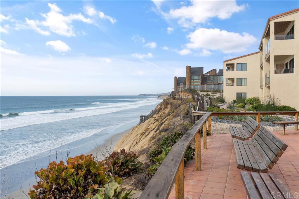 Oceanview Condo in Solana Beach & Tennis Club~ Enjoy stunning panoramic ocean views/white water views from this beautifully appointed condominium perched on the bluffs of the sought-after Solana Beach and Tennis Club. This coastal retreat offers direct beach access, resort-style amenities including a pool, spa, tennis courts, elevators and two secure underground parking spaces. Inside, the home features a cozy fireplace, two balconies with ocean views, a front patio—perfect for relaxing or entertaining while taking in the ocean breeze. The primary bedroom ensuite includes dual closets, while the second bedroom features a closet and a dedicated storage area for beach gear. A stacked washer and dryer is conveniently located in the kitchen. Live the ultimate beach lifestyle just a short walk from the sand, dog beach, local dining, and the Del Mar racetrack.