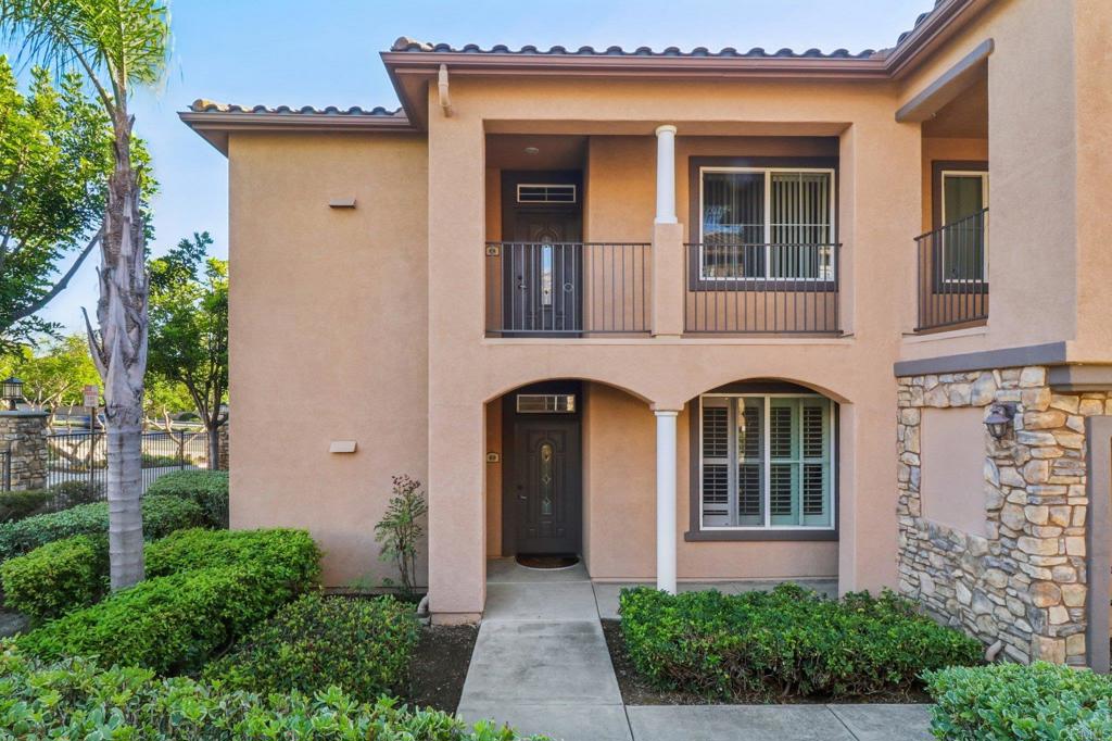This stunning ground-level condo at 10978 Serafina Ln #69 is a rare find—it was originally the community's model home, offering premium finishes and an impeccably designed floor plan. Experience luxury from the moment you step inside with gorgeous, rich cherry hardwood floors extending throughout the main living areas, complemented by custom wood shutters on every window for light control and privacy. The open and inviting floor plan features a spacious living room with a cozy fireplace that flows seamlessly to a private patio, perfect for enjoying the San Diego indoor-outdoor lifestyle. The kitchen is both functional and beautiful, offering warm cabinetry, granite countertops, and breakfast counter seating. Located in the highly sought-after Savannah Terrace community, residents enjoy resort-style amenities including a sparkling pool, spa, sauna, steam room, gym, media room, library, barbecue areas, and tennis and racquetball courts. This exceptional location is within the boundaries of the highly-rated Poway Unified School District. Enjoy easy access to shopping, dining, parks, and freeway access in the desirable Sabre Springs neighborhood. This is an opportunity to own a perfectly appointed, move-in-ready model home in one of San Diego's best communities!