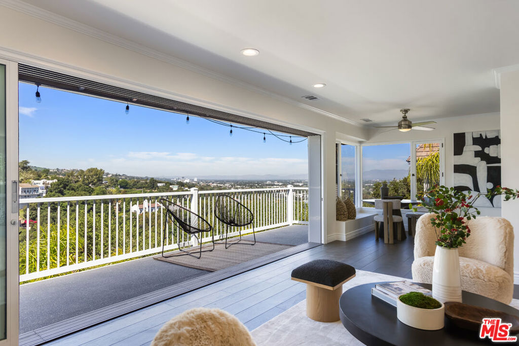 Perched on a quiet hillside above Studio City, this mid-century retreat offers panoramic views and a tranquil sense of escape while still just moments from the heart of Ventura Blvd. Set on a generous 13,500 sq ft lot, the home seamlessly blends indoor-outdoor living with the timeless charm of clean lines, natural light, and thoughtful design.The main level features a bright and airy 2BD/2BA layout, where walls of glass frame stunning valley views and a granite fireplace anchors the open-concept living and dining areas. The adjacent chef's kitchen is ideal for entertaining or quiet nights in, all flowing effortlessly to an oversized deck made for sunrise coffee and sunset wine.Downstairs, a spacious 1BD/1BA extension continues the vibe, with its own living area, kitchen, and direct access to a peaceful covered patioperfect for guests, working from home, or creating your own retreat space.A detached 2-car garage and lush hillside surroundings complete this private, versatile property. Whether you're seeking a serene primary residence, a space to grow into, or a smart investment, this is Studio City living at its best calm, connected, and full of possibility.