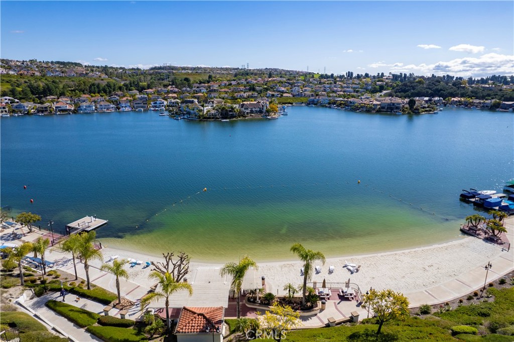 Prime Location! Golf Course-Front Living with Lake Mission Viejo Privileges in a Gated Community of Alta Finisterra! Remodeled 2-bedroom, 2-bathroom condo offers modern luxury, new double pane windows with automatic remote-controlled window treatments, large floor tiles, upgraded recessed and motion sensor lights throughout. Inside, you'll find central heating and cooling, an inside laundry area. The bright living room which offers stunning golf- course views, is anchored with a cozy fireplace. The main bedroom suite is a private retreat with spacious walk-in closet and an update ensuite bathroom. Enjoy your morning coffee on a secluded balcony which provides direct access to the lush golf course greenbelt. With a detached garage and a dedicated carport parking, this home defines easy upscale Orange county living. Your HOA includes a year-round heated pool and spa, resort living, security gates, and more importantly, full membership to Lake Mission Viejo. Spend your weekends sailing, fishing, enjoying lakeside concerts, or just walk to local shops and restaurants, this location is hard to beat! Offers are being reviewed as they come in. Don't wait---submit your best offer now!