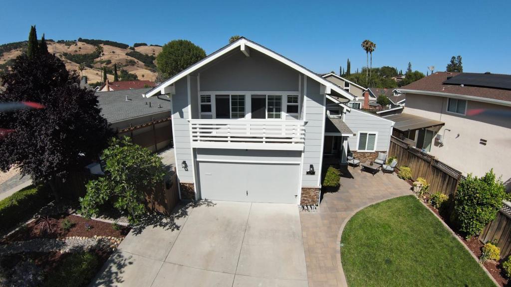 Walk into this home with its majestic high tray ceiling, modern chandeliers, and acacia wood flooring. This home is ready for you to move in and start making memories! Sellers raised three kids, and now they're all in college; it's time to downsize. The kitchen has been completely remodeled with custom cabinets, stainless steel appliances, quartz countertops, and a large walk-in pantry under the stairs. The backyard was designed for entertaining with a built-in gas grill, a gas fire pit, a well-lit pergola, and beautiful views of the Santa Teresa hills. The primary ensuite offers a recently remodeled bathroom and expansive windows. The living room is great for family night or a cozy day relaxing and reading a book. This house has undergone upgrades over the years, and you will enjoy every detail it has to offer.
