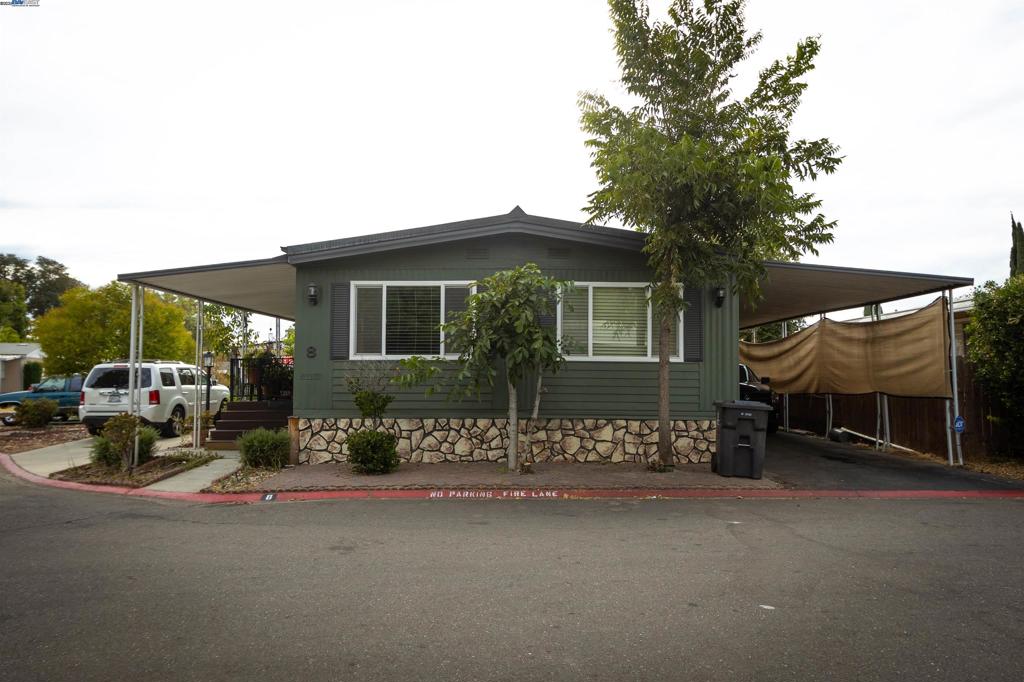 Welcome to Shadow Lake Mobile Park – An All-Ages Community! Don’t miss this opportunity to own a spacious 3-bedroom, 2-bath home in one of the area's most sought-after mobile home communities. Located on a desirable corner lot, this home offers a bright and open layout with a generous living room and formal dining area, perfect for gatherings and entertaining. The kitchen opens up to a cozy family room, creating a flexible and comfortable space for everyday living. Step outside to enjoy the large front yard, a full-length covered front porch, and plenty of parking with a 2-car covered carport and an additional uncovered front parking spot. Additional features include two storage units, proximity to guest parking, and access to incredible community amenities including multiple playgrounds, swimming pools, a spa, clubhouse, and even a serene duck pond. Conveniently located with easy access to highways and nearby shopping, this home has everything you need. Interior photos coming soon – stay tuned! Fireplaces: NO
