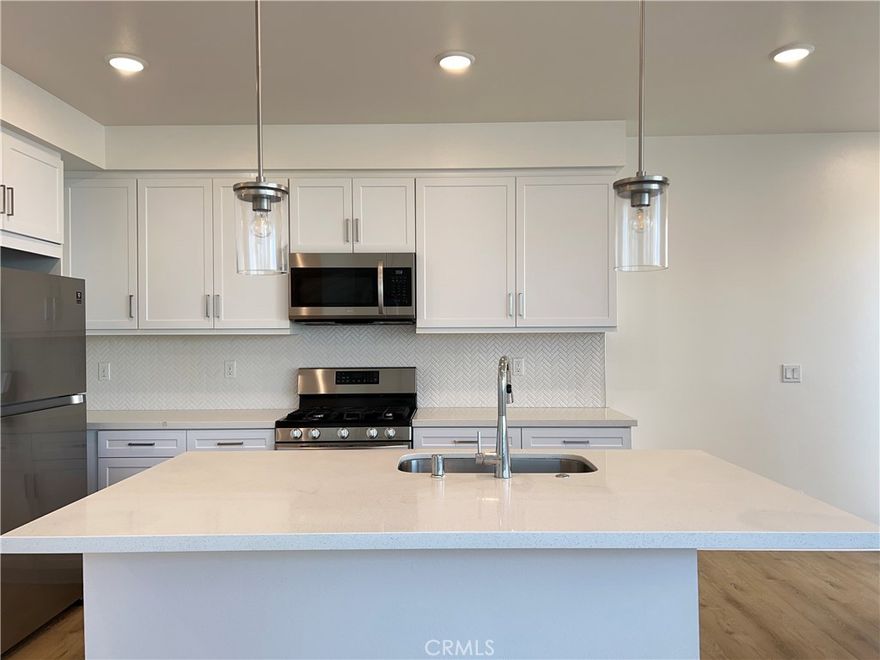 ***Open House Sat Dec 13 FROM 11:30AM-12:00PM*** Welcome to The Resort, where contemporary elegance meets everyday ease in this charming 2-bed, 2-bath condo. Upon entry, you'll be enchanted by the seamless flow of the kitchen and family room, boasting sleek quartz counters and a bespoke
backsplash. This inviting area is perfect for cooking, mingling, or unwinding with your favorite TV shows. Adjacent to the living space lies a snug
balcony, beckoning you to enjoy a glass of wine while soaking in California's breathtaking sunsets. When relaxation calls, the master suite awaits,
boasting a generous walk-in closet and a private bathroom. The second bedroom offers equal spaciousness and versatility, ideal for guests, family,
or a home office. Streamlining your chores is an indoor laundry area, ensuring hassle-free task completion. Parking worries fade away with a roomy
2-car tandem garage, providing ample space for vehicles and recreational equipment. Additional guest parking is conveniently located nearby.
Embrace modern convenience with smart features like a Ring doorbell, keypad entry, and a smart thermostat, putting home security and comfort at
your fingertips. Situated within walking distance of Target, Kohl's, Ontario Mills, and the Toyota Arena, everything from shopping to dining to
entertainment is just steps away. Don't let this opportunity slip by—schedule your tour today and embrace a fulfilling, active lifestyle at The Resort!