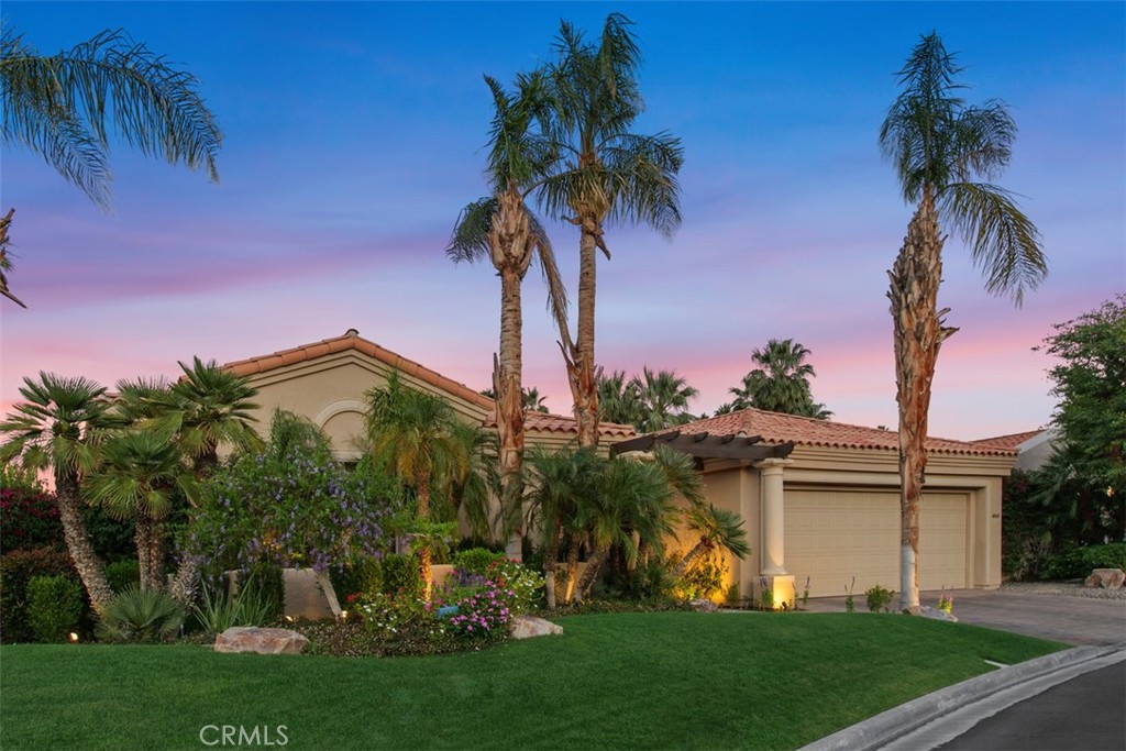 Welcome to your own slice of paradise in one of Palm Desert’s most sought-after communities. This ultra-private, Bali-inspired single-story home is tucked away on a quiet cul-de-sac, surrounded by lush, tropical landscaping that makes every day feel like a resort vacation.
Enjoy the ultimate in indoor-outdoor living with your own private pool and spa, perfect for soaking up the sun or hosting unforgettable gatherings. This home is also equipped with owned solar, helping you save on energy costs while living sustainably.
Designed for comfort and flexibility, the home features three spacious bedrooms—including the potential for two primary suites—a media room, and an oversized family/dining room perfect for entertaining or relaxing in style. Natural light and open spaces flow throughout, creating a tranquil, welcoming atmosphere.
A three-car garage adds convenience and storage, while nearby Ironwood Country Club offers optional social and golf memberships, giving you access to world-class amenities just minutes away.