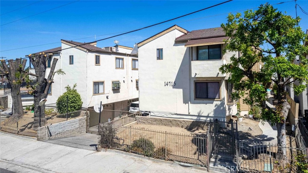 Welcome to 14715 Saticoy St, Unit 13, a beautifully maintained corner-unit townhouse in the heart of Van Nuys. Offering 2 bedrooms, 2.5 bathrooms, and 1,090 sq. ft. of thoughtfully designed living space that blends comfort, privacy, and modern style. Once inside to a bright and open living area with elegant flooring, abundant natural light, and a seamless flow into the dining and kitchen spaces. The updated kitchen features plentiful cabinetry, a breakfast bar, and a natural connection to the dining area. Upstairs you’ll find two spacious bedrooms, each with its own private en-suite bathroom for maximum comfort, including a primary suite retreat with a private balcony! Guest powder room is conveniently located on the main floor. Additional highlights include an attached garage with direct access, in-unit laundry, central A/C and heating, and the security of a gated community, all within a desirable corner-unit layout that enhances both privacy and livability.