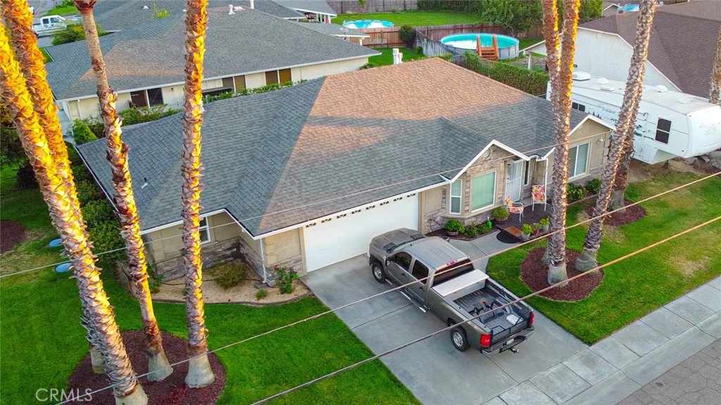 Stunning Custom Home on a Spacious Corner Lot in Antelope Area! Welcome to this gorgeous 3-bedroom, 3-bathroom home, perfectly designed with an open concept floor plan and thoughtful details throughout. Situated on a desirable corner lot, this home offers both privacy and convenience. Two luxurious principal suites, each with private bathrooms, walk-in closets, and direct access to the covered patio – perfect for relaxing in privacy. The third bedroom also enjoys its own bathroom, ensuring comfort for guests. One suite features a soothing jetted spa tub, while the other offers a spacious double-headed shower. Both are equipped with double vanities for added convenience. A double-sided gas stone fireplace serves as the centerpiece of the living room and one of the principal bedrooms, creating a warm, cozy atmosphere. Enjoy the beauty of wood flooring, vaulted ceilings, and stylish tile throughout the home. The kitchen boasts all necessary amenities, and still has the hookup for a wine fridge, if you want to add that personal touch. Air conditioner is only 5 years old. Additionally, the yards feature lush, recently trimmed palm trees, plus a majestic redwood as well as automatic watering and drip system for hassle-free garden care. It’s the ideal space for outdoor entertaining or simply unwinding. Three sliding glass doors lead to the outdoor patios, one of which is dedicated to each of the principal bedrooms. No need to worry about flooding, as the home is not in a flood zone. The property is served by Patterson Water District and community septic. Enjoy easy access to local amenities, with the middle school just a short walk away. Ample parking ensures plenty of space for you and your guests. A small, inviting porch at the front of the home is the perfect spot for your morning coffee or a quiet evening. This home blends modern comfort with thoughtful design – making it the perfect place to call your own. Don’t miss the opportunity to make this beauty yours!