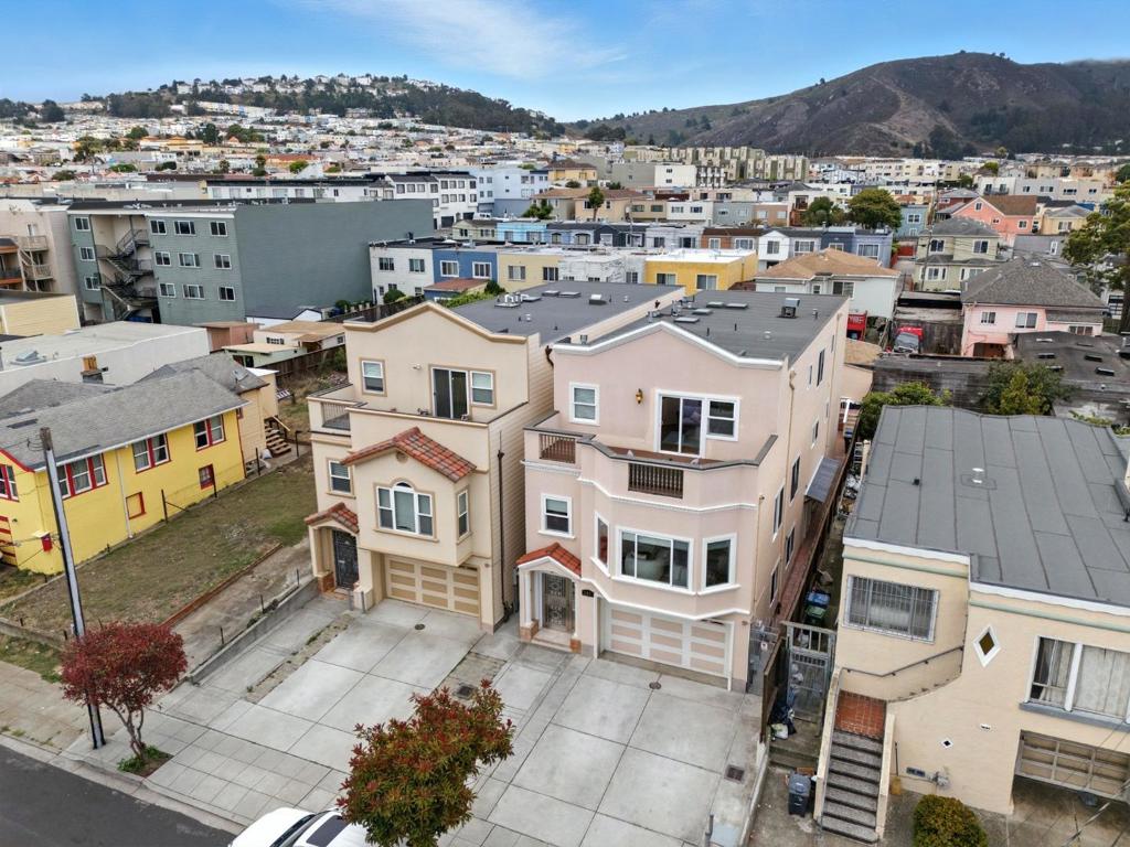 Welcome to 157 Station Avenue, Daly City, CA a truly remarkable home that perfectly marries elegance with practicality. First time on market since it was built in 2009. Spanning 4,345 square feet, this exquisite residence includes 7 bedrooms and 6 beautifully designed bathrooms, with 3 ensuites, 1 office and an ADU on ground level. The primary suite on the third floor features a balcony with serene bay views. All ensuites are thoughtfully designed with walk-in closets. The kitchen, equipped with premium Thermador appliances, sets the stage for exceptional culinary experiences. Whether for intimate gatherings or grand soirées, the home's layout provides a graceful setting. ADU on ground level enhances the property, generating $3,950 monthly, offering financial flexibility and versatility for guests or family. Set on a 3,360 square foot lot, it offers ample parking, including a driveway for three cars and an attached two-car garage. The low-maintenance backyard, with a storage shed and connecting decks, allows easy access from each level. Discover the blend of style and investment opportunity at 157 Station Avenue a lifestyle statement waiting to be your elegant escape.