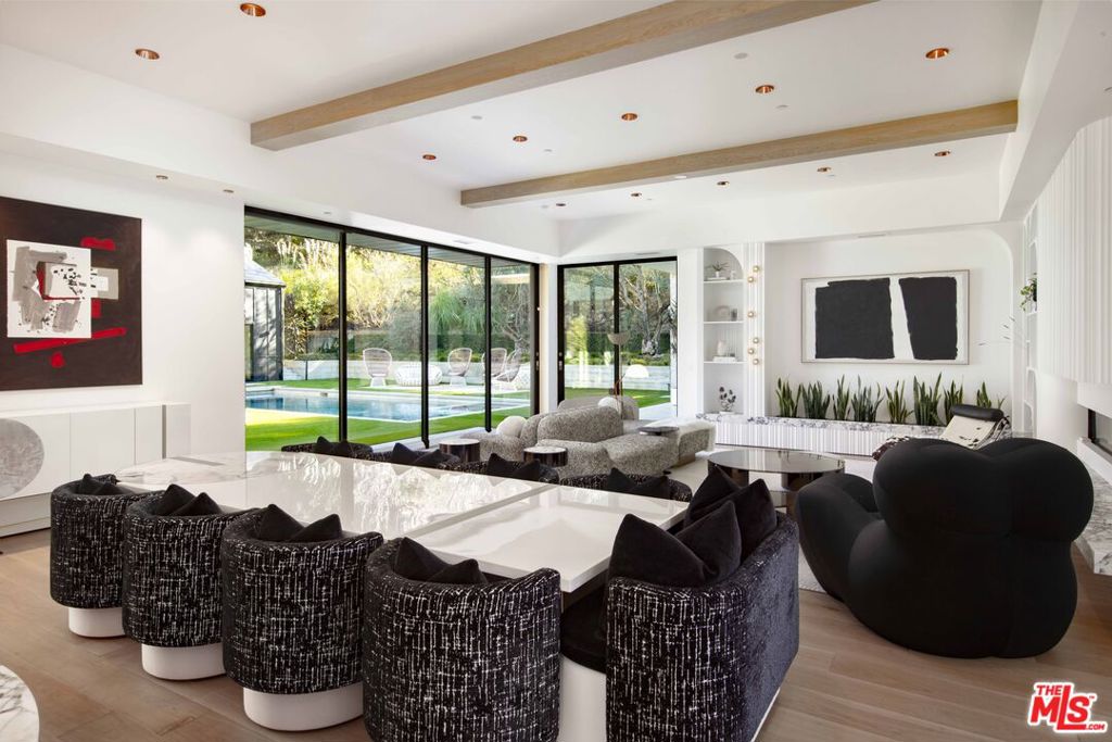 A modern masterpiece in the heart of Hope Ranch, this 2024 remodeled home exudes chic, contemporary design. Single-level living and an open floor plan effortlessly connect the interior to lush, meticulously landscaped outdoor spaces. The second level studio is ideal for fitness and "sky lounge" is perfect for entertaining. Expansive walls of glass open to a serene courtyard with a pool and spa, seamlessly blending with the surrounding greenery. The newly renovated chef's kitchen and spa-like bathrooms feature sleek finishes, while radiant heat and advanced smart home technology elevate everyday living. A spacious primary suite with a large walk-in closet and luxurious bath offers a true retreat. With a private access beach, this home is the ultimate expression of Santa Barbara luxury.