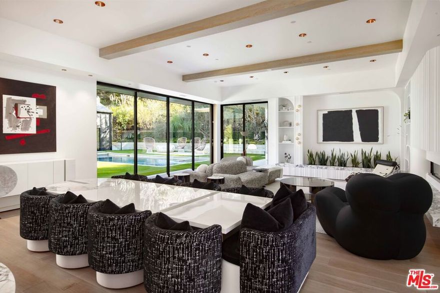 A modern masterpiece in the heart of Hope Ranch, this 2024 remodeled home exudes chic, contemporary design. Single-level living and an open floor plan effortlessly connect the interior to lush, meticulously landscaped outdoor spaces. The second level studio is ideal for fitness and "sky lounge" is perfect for entertaining. Expansive walls of glass open to a serene courtyard with a pool and spa, seamlessly blending with the surrounding greenery. The newly renovated chef's kitchen and spa-like bathrooms feature sleek finishes, while radiant heat and advanced smart home technology elevate everyday living. A spacious primary suite with a large walk-in closet and luxurious bath offers a true retreat. With a private access beach, this home is the ultimate expression of Santa Barbara luxury.