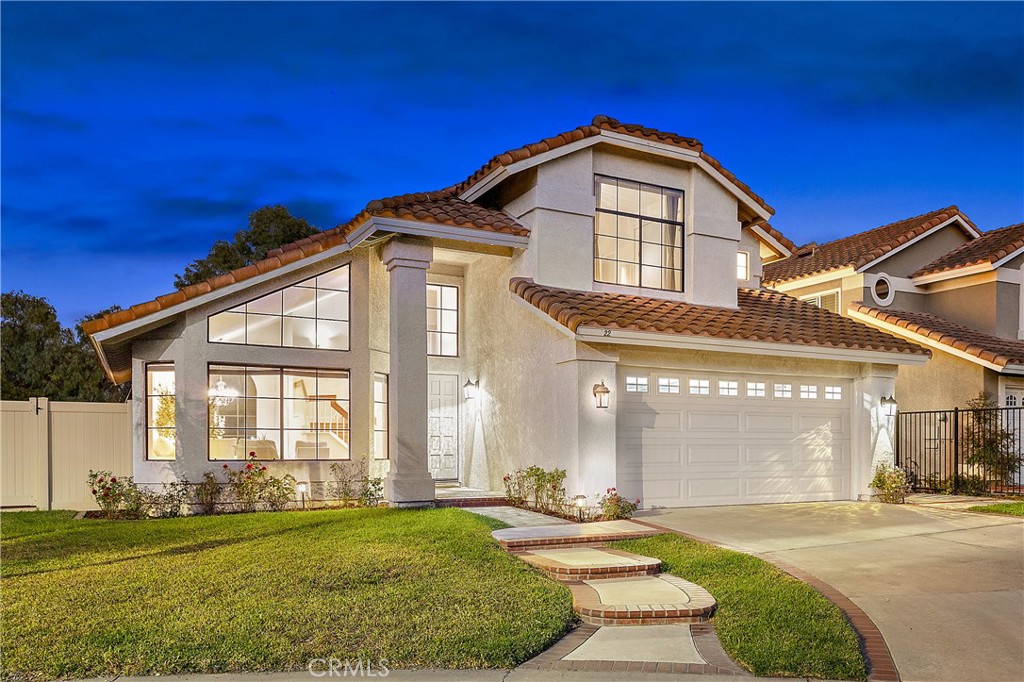 Your next chapter starts here! Welcome to a home that blends space, comfort, and everyday functionality. Set in the friendly Arroyo Oaks community, this 4-bedroom, 2.5-bath residence offers a bright and versatile layout designed for easy living. From the moment you step inside, soaring ceilings and natural light create an inviting atmosphere. The open living and dining areas flow seamlessly together, making it simple to host everything from casual family dinners to relaxed get-togethers with friends. At the heart of the home, the family room features a cozy updated fireplace and views of the private backyard, while the adjacent kitchen provides plenty of cabinet space, new countertops, and a practical layout for daily use. A sliding glass door opens directly to the oversized patio—perfect for outdoor dining, gardening, or simply enjoying the fresh air and mountain views. Recent updates such as PEX repiping, new main garage door with fiber glass windows, new side garage door, recessed lighting, upgraded water heater, engineered wood flooring and travertine accents bring peace of mind and modern comfort. Upstairs, four bedrooms provide flexible space for family, guests, or even a home office. The primary suite feels like a retreat with its dramatic ceilings, while the additional bedrooms are equally comfortable and versatile. The garage offers generous storage for hobbies, sports gear, or extra belongings, and the backyard—with its new vinyl fencing, upgraded patio, and landscaped details—provides a private setting for play, relaxation, or entertaining. As part of Arroyo Oaks, you’ll also enjoy community amenities including a sparkling pool, relaxing spa, and a sport court—all within easy reach. With top-rated schools, shopping, dining, and recreation nearby, this home offers the ideal balance of comfort, convenience, and community.