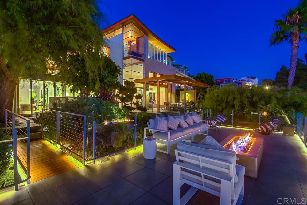 The Wave House SD is an architectural jewel, envisioned and brought to life by the award-winning firm Safdie Rabines Architects. Perched atop the prestigious Mission Hills—one of San Diego’s most storied neighborhoods—this contemporary masterpiece offers unparalleled vistas that will leave every guest captivated. Hosting gatherings or celebrations here ensures you’ll be the envy of all who visit. Located at 2477 Presidio Drive, the estate encompasses approximately 4,454 sq. ft. across a stunning main residence, a private casita, and a beautifully appointed pool house. The main home is anchored by a breathtaking 35-foot light-filled atrium, serving as a dramatic central axis that seamlessly connects all three levels while opening the entry to the terraced gardens below. The interiors are defined by soaring ceilings, curated living spaces, and walls of glass that blur the boundaries between indoor luxury and outdoor beauty. The family room, nestled into the hillside, extends effortlessly into lush gardens, while the elevated living room, dining area, and chef’s kitchen are positioned to maximize panoramic bay views. Above it all, the primary suite reigns supreme—your private sanctuary in the sky. Additional highlights include: Top-of-the-line appliances and designer finishes Multiple balconies for seamless indoor–outdoor living A custom fire pit for evening gatherings Exceptional spaces for both intimate moments and grand entertaining This home is more than a residence—it is a statement of modern design, a stage for unforgettable experiences, and a canvas for San Diego’s most enviable views. Schedule your private tour today of this extraordinary estate—an opportunity this rare will not last.