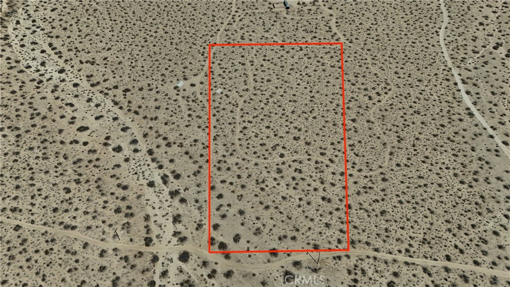 Here’s your chance at five acres of desert freedom in Landers, just across the highway from the legendary King of the Hammers race grounds. Close enough to enjoy the excitement, far enough to kick back when the dust settles. Power runs along the front of the property, so getting connected is straightforward. For water, you can drill a well when the time is right, or use the Bighorn Desert View Water Company’s bulk water stations until then. Haul it in, store it, and you’re set. The property even comes with a cement slab already in place. Whether you see it as a head start for building, a spot for your RV, or just the world’s most durable dance floor, it’s nice to have a solid foundation waiting for you. Five acres is plenty of room to make your desert plans happen, whether that’s a private getaway, a spot for your toys, or an investment to hold onto. And if you’re dreaming bigger, the adjacent five acre lot is also available for sale, giving you the option of ten acres total. Twice the land, twice the possibilities. To make things even better, several pieces of government owned land surround the property. That means more open views, fewer neighbors, and a bigger backyard feel without paying for the extra acreage. Come take a look and see the potential for yourself. This much land with this much potential won’t sit around forever. **This property does not have an address assigned. "774 Manzanita Rd" is for listing purposes only.
APN# 0454-221-34-0000
Coordinates:34.351539 / -116.539924