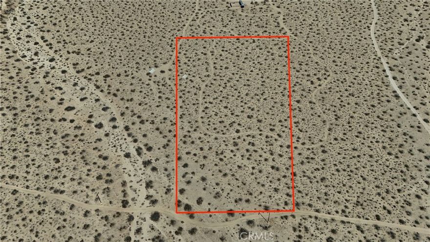 Here’s your chance at five acres of desert freedom in Landers, just across the highway from the legendary King of the Hammers race grounds. Close enough to enjoy the excitement, far enough to kick back when the dust settles.  Power runs along the front of the property, so getting connected is straightforward. For water, you can drill a well when the time is right, or use the Bighorn Desert View Water Company’s bulk water stations until then. Haul it in, store it, and you’re set.  The property even comes with a cement slab already in place. Whether you see it as a head start for building, a spot for your RV, or just the world’s most durable dance floor, it’s nice to have a solid foundation waiting for you.  Five acres is plenty of room to make your desert plans happen, whether that’s a private getaway, a spot for your toys, or an investment to hold onto. And if you’re dreaming bigger, the adjacent five acre lot is also available for sale, giving you the option of ten acres total. Twice the land, twice the possibilities. To make things even better, several pieces of government owned land surround the property. That means more open views, fewer neighbors, and a bigger backyard feel without paying for the extra acreage.  Come take a look and see the potential for yourself. This much land with this much potential won’t sit around forever.  **This property does not have an address assigned. "774 Manzanita Rd" is for listing purposes only.

APN# 0454-221-34-0000

Coordinates:34.351539 / -116.539924