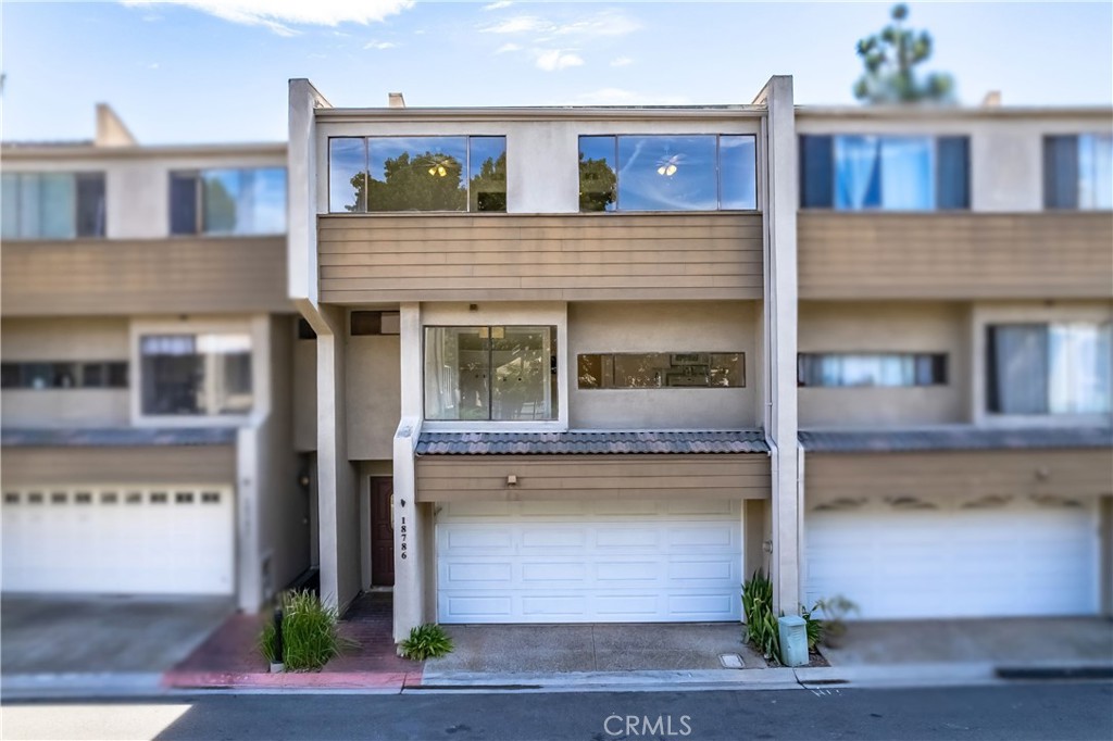 This 3-bedroom, 2.5-bath townhome offers over 1700 square feet of living space in the centrally located Village Court community. Walking distance to shopping, dining and entertainment, biking distance to Downtown Huntington Beach, the pier and the beach, and a short drive to the freeways! Upgraded hard surface flooring throughout, brand new custom paint, two story ceilings, central AC, and custom light fixtures. The living room has high ceilings, a fireplace, and dual sliders that open to a private patio. The kitchen a breakfast nook, gas range, microwave and sunny breakfast nook. The primary suite has tall ceilings, a walk-in closet, and a bath with dual sinks and a large walk-in shower. Secondary bedrooms share a full bath with a soaking tub and shower combo. The home has direct access to a two car garage with storage. The Village Court community offers tennis courts, a racquetball court, pool and spa. The neighborhood is also now located in the SeaCliff Elementary School district.