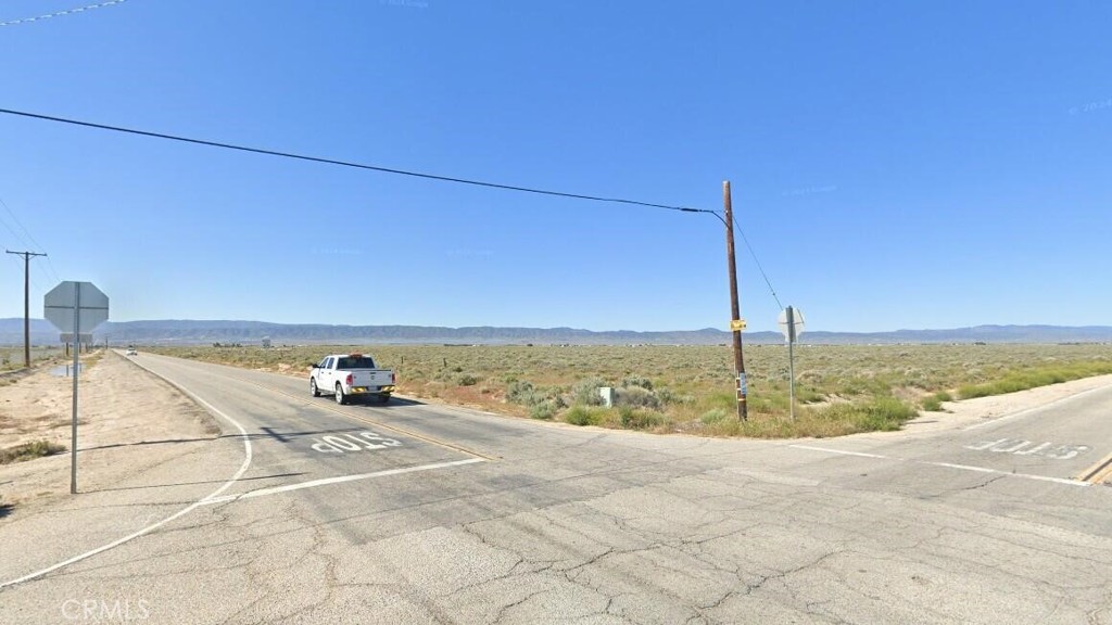 13.27 corner industrial lot. Zoning is LRMPD. The lot has 280 feet of paved frontage on 60th Street West, and 1285 feet of paved frontage on Ave F. APN 3201-012-013. Close to the 14 Freeway, Fox Field, and Apollo Park. Power is in the street.
