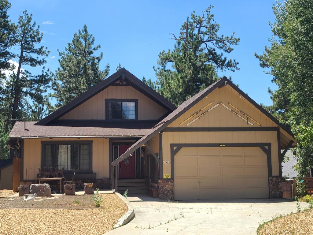Charming four-bedroom, three-bath mountain chalet in Big Bear Lake West. Nestled close to the Lake on three levels, this custom-built retreat features a master suite loft, a total of 5 sleeping areas 3 full baths. Set on an oversized 11,000 SF lot with level entry, room for an RV and even a boat as well in addition to the attached two-car garage. The kitchen with granite countertops, stainless steel appliances seamlessly opens into the spacious living room, highlighted by an oversized rock fireplace and cathedral ceilings. The main level opens onto the back deck with peek-a-boo lake view. Great for those seeking a blend of luxury and alpine charm. Downstairs is the oversized game room with pool table, another fireplace, bedroom and bath. (Lower level bedroom is not permitted for Vacation Rental Per City) but is part of Livable SF